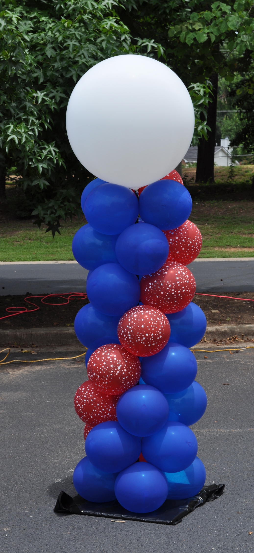 Red white and blue outdoor balloon column