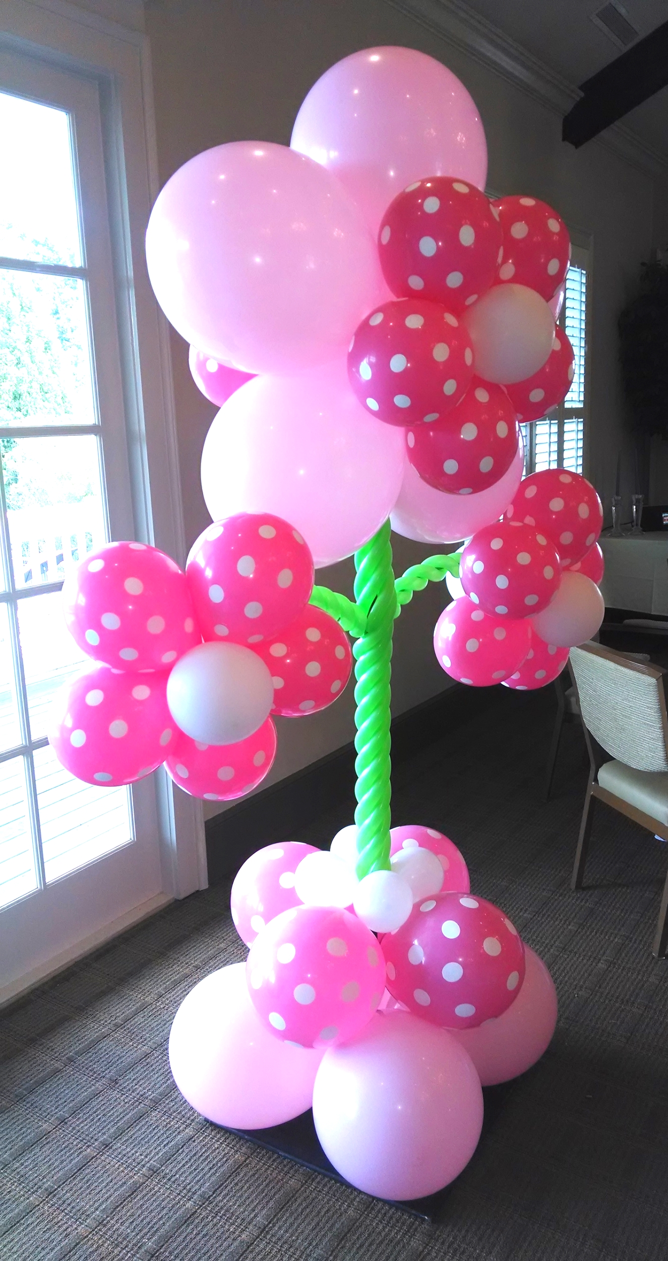 Pink balloon flower for a gender reveal party