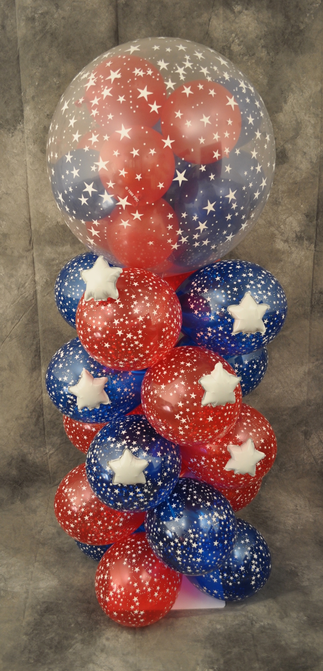 Red white and blue balloon column