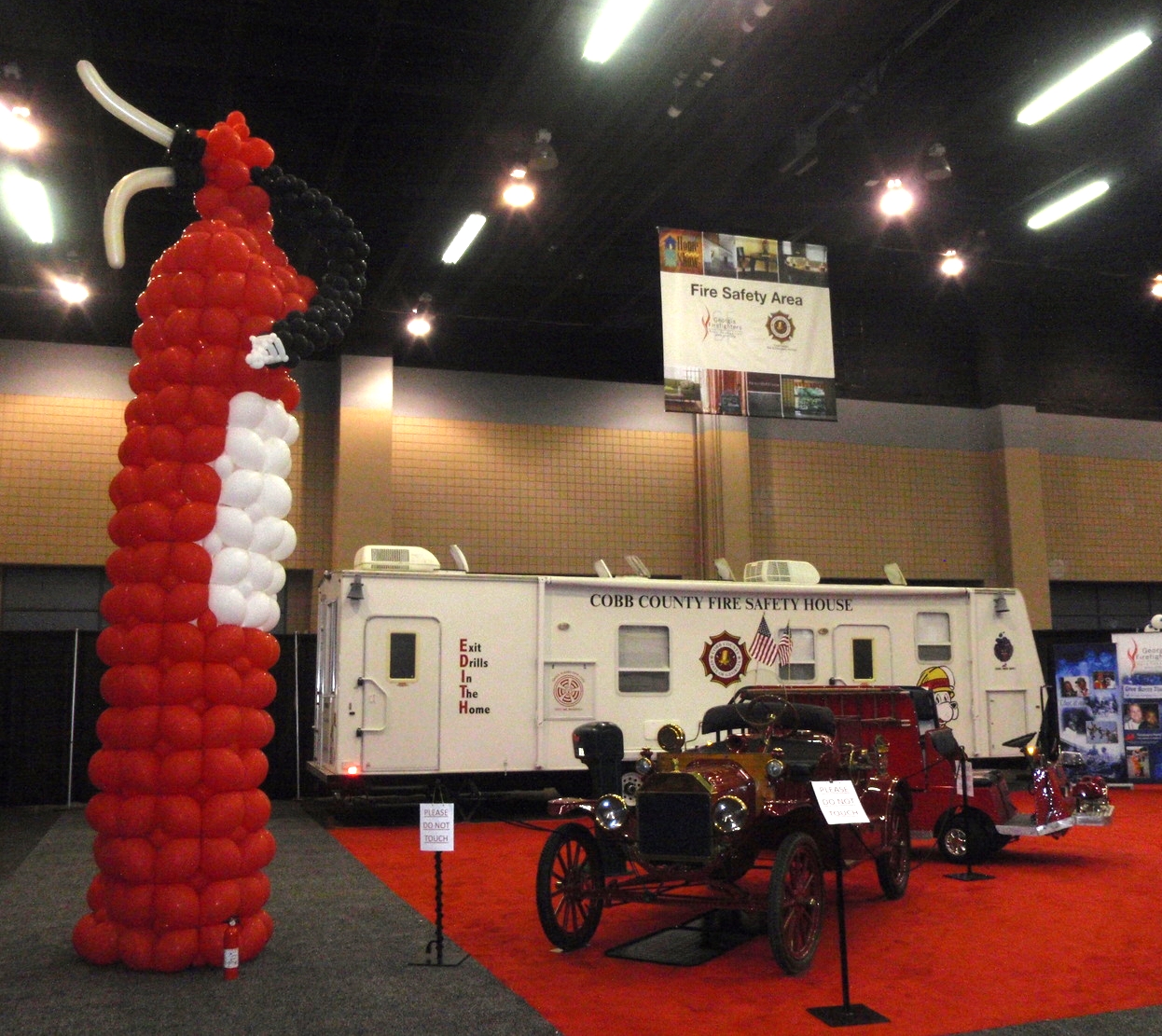 Fire safety center with giant balloon fire extinguisher