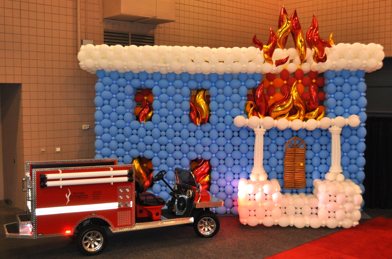 Burning house backdrop for fire truck