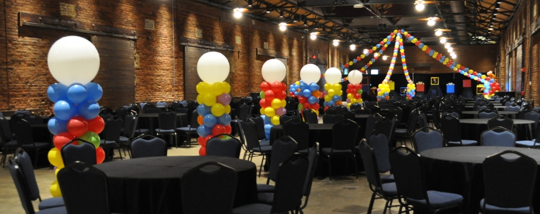 Circus-themed prom balloon columns and dance floor