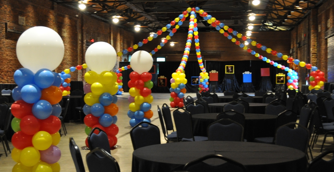 Circus-themed prom balloon columns and dance floor
