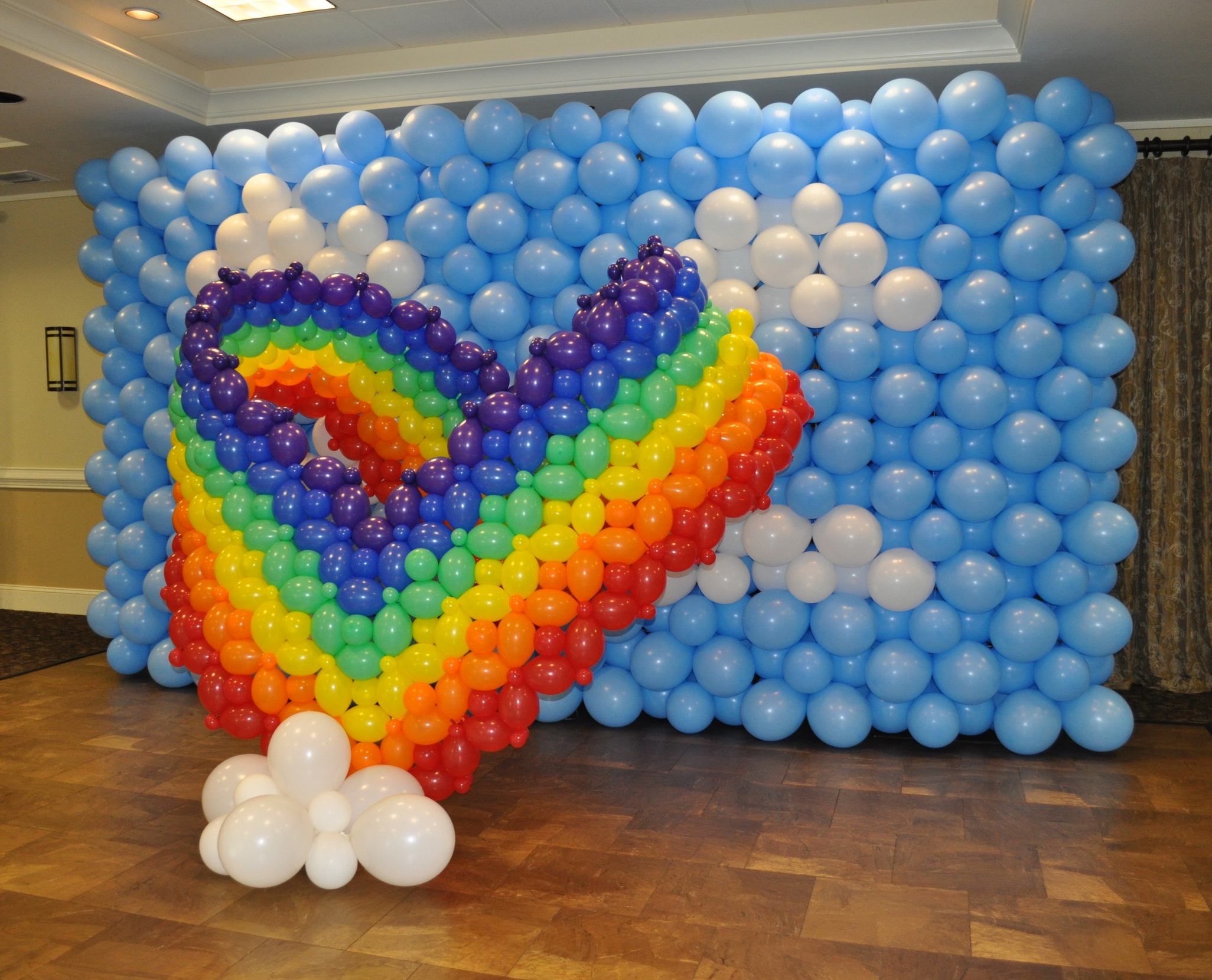 Rainbow heart balloon sculpture photo backdrop