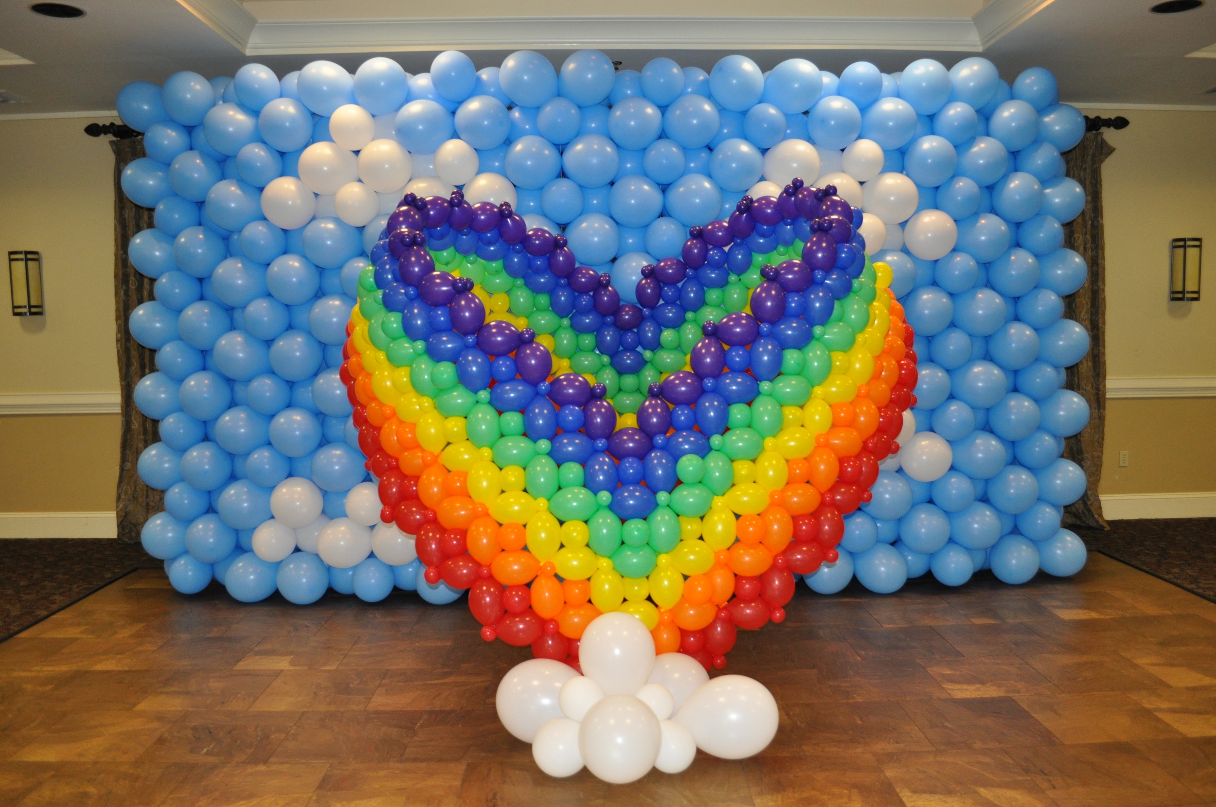Rainbow heart balloon sculpture photo backdrop