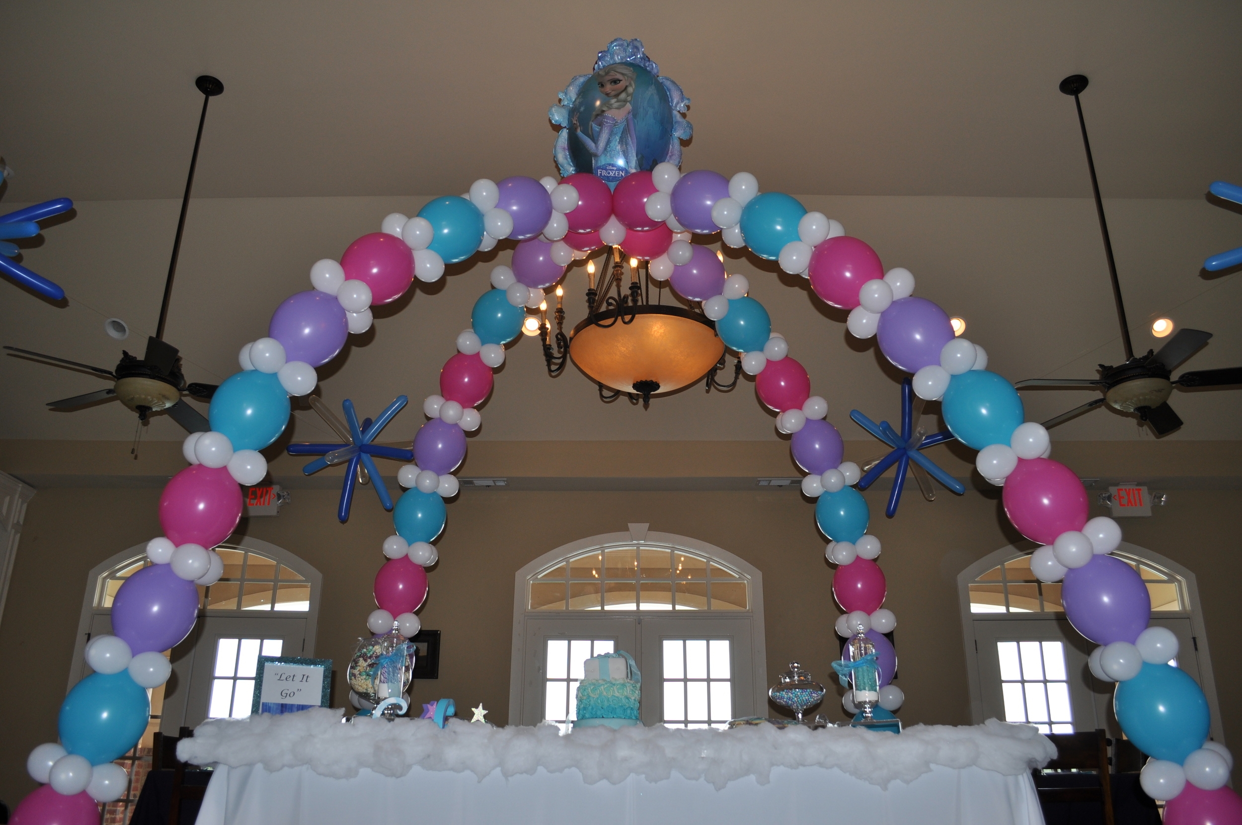 Frozen themed birthday party balloon cake table