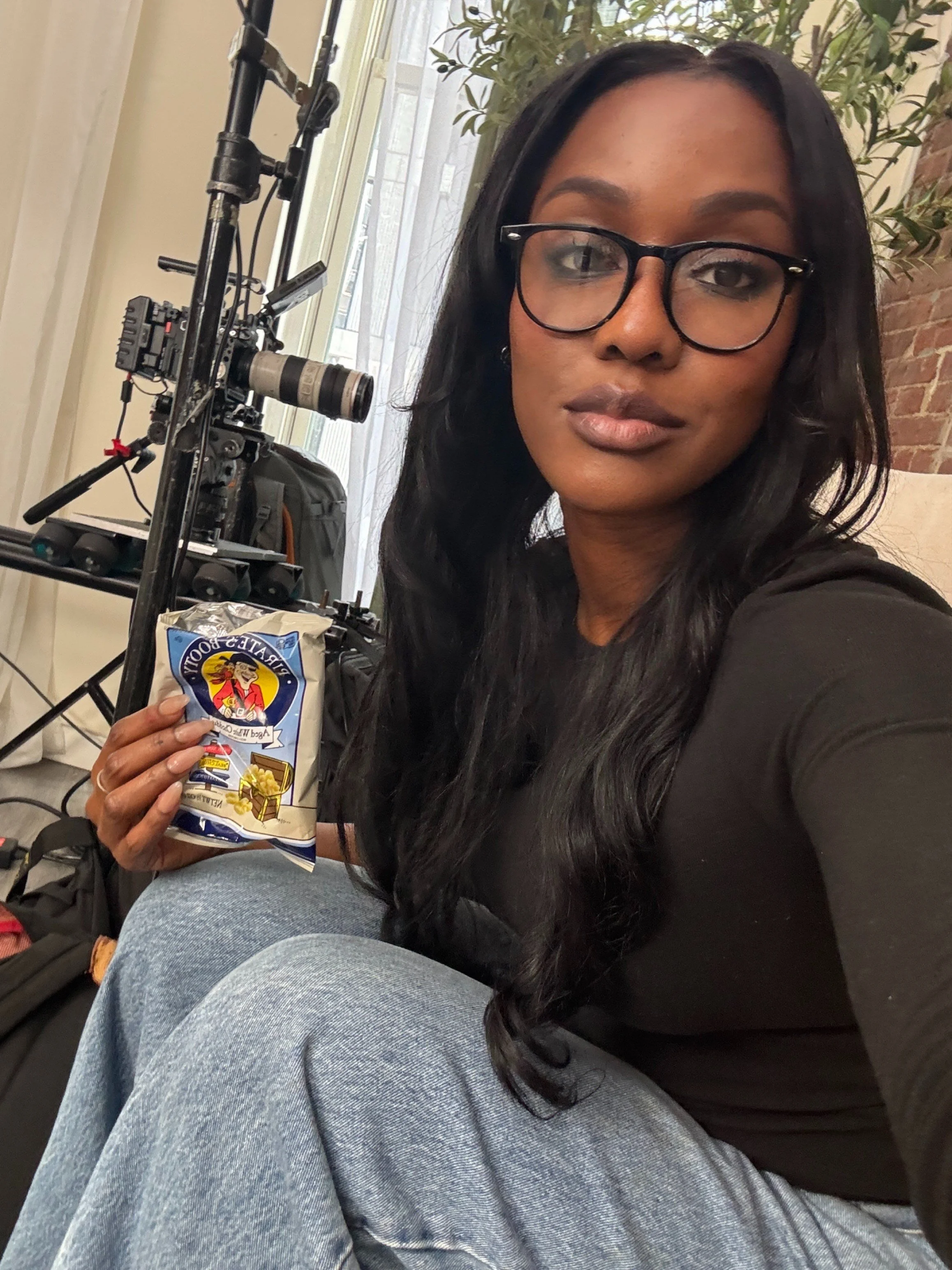Makeup artist working behind the scenes for a podcast.