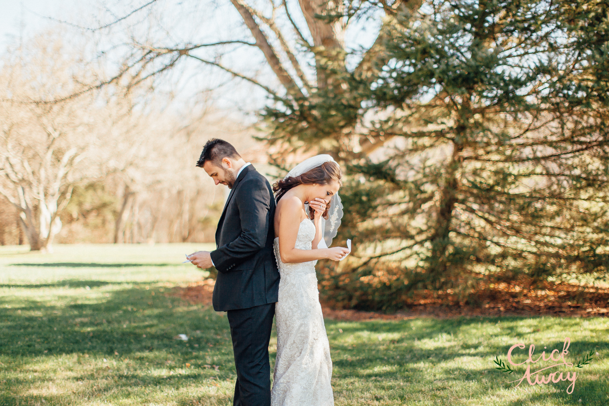 bride and groom reading personal vows