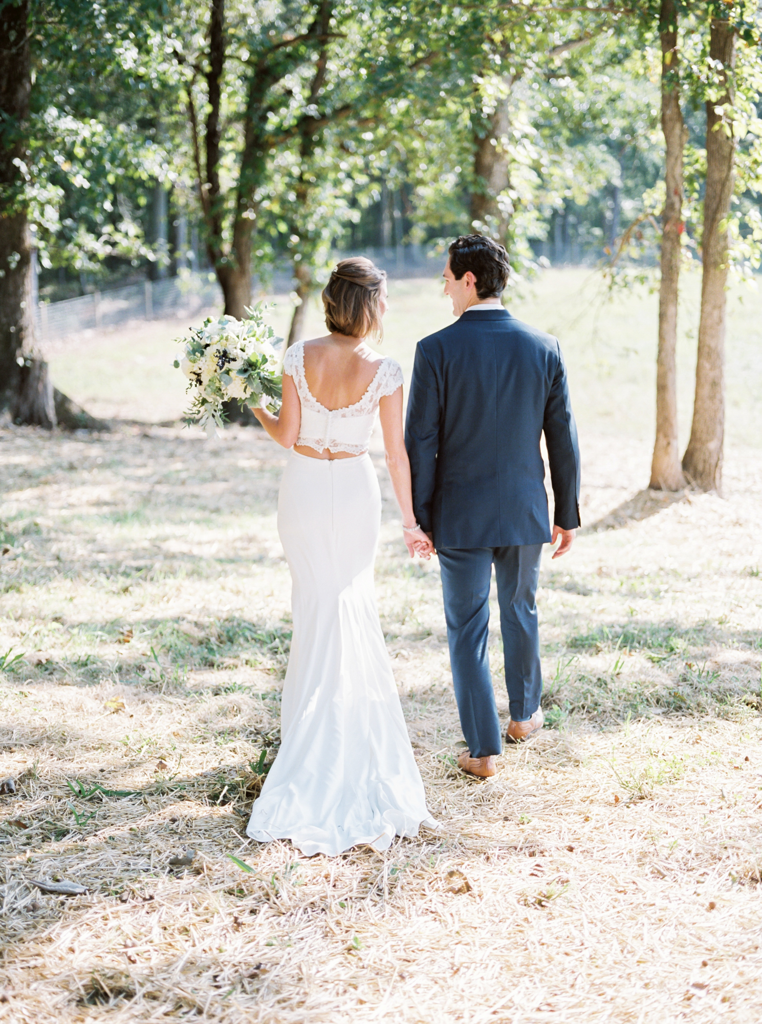 bride and groom walking away