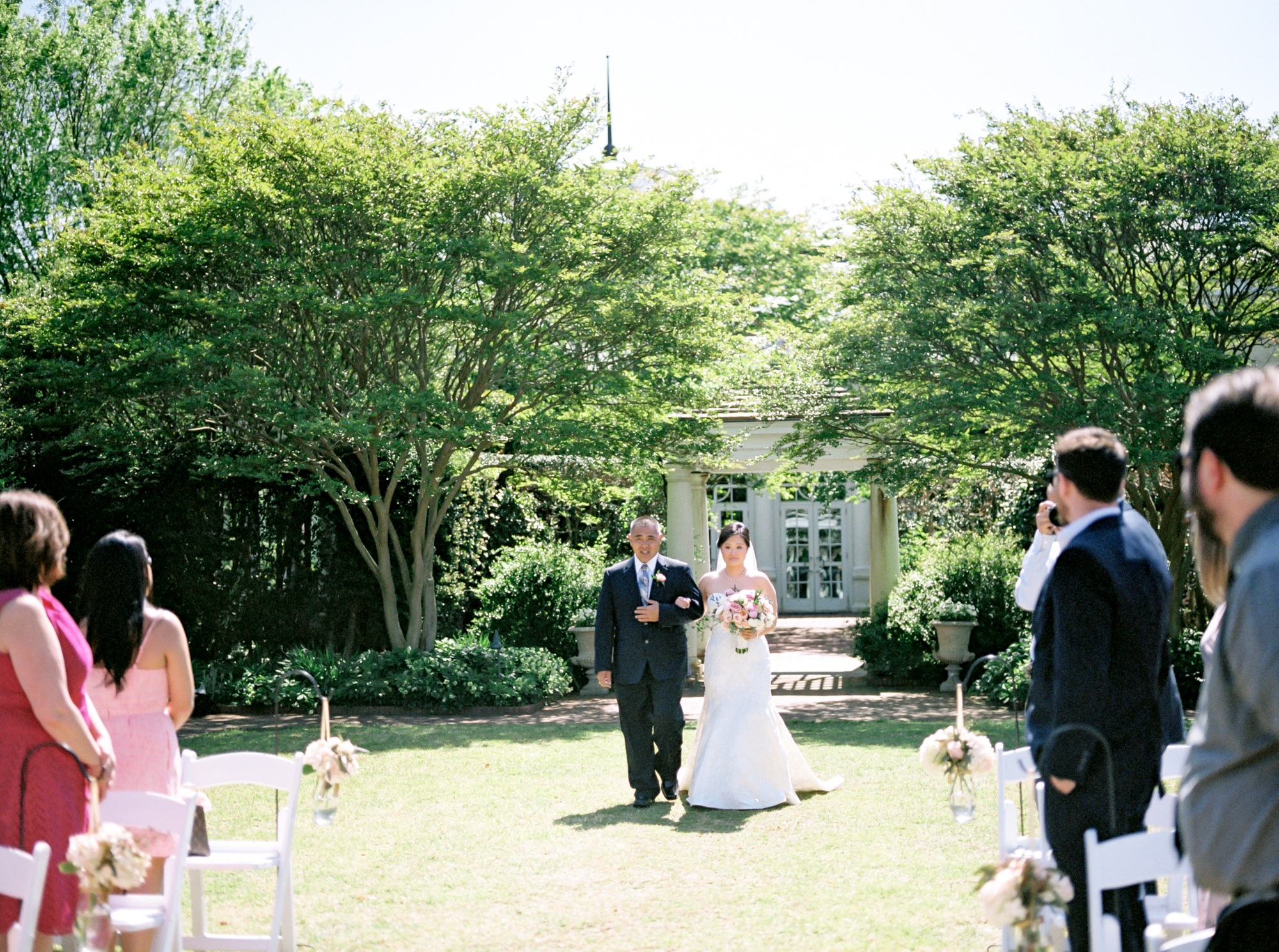 father walks bride down the aisle
