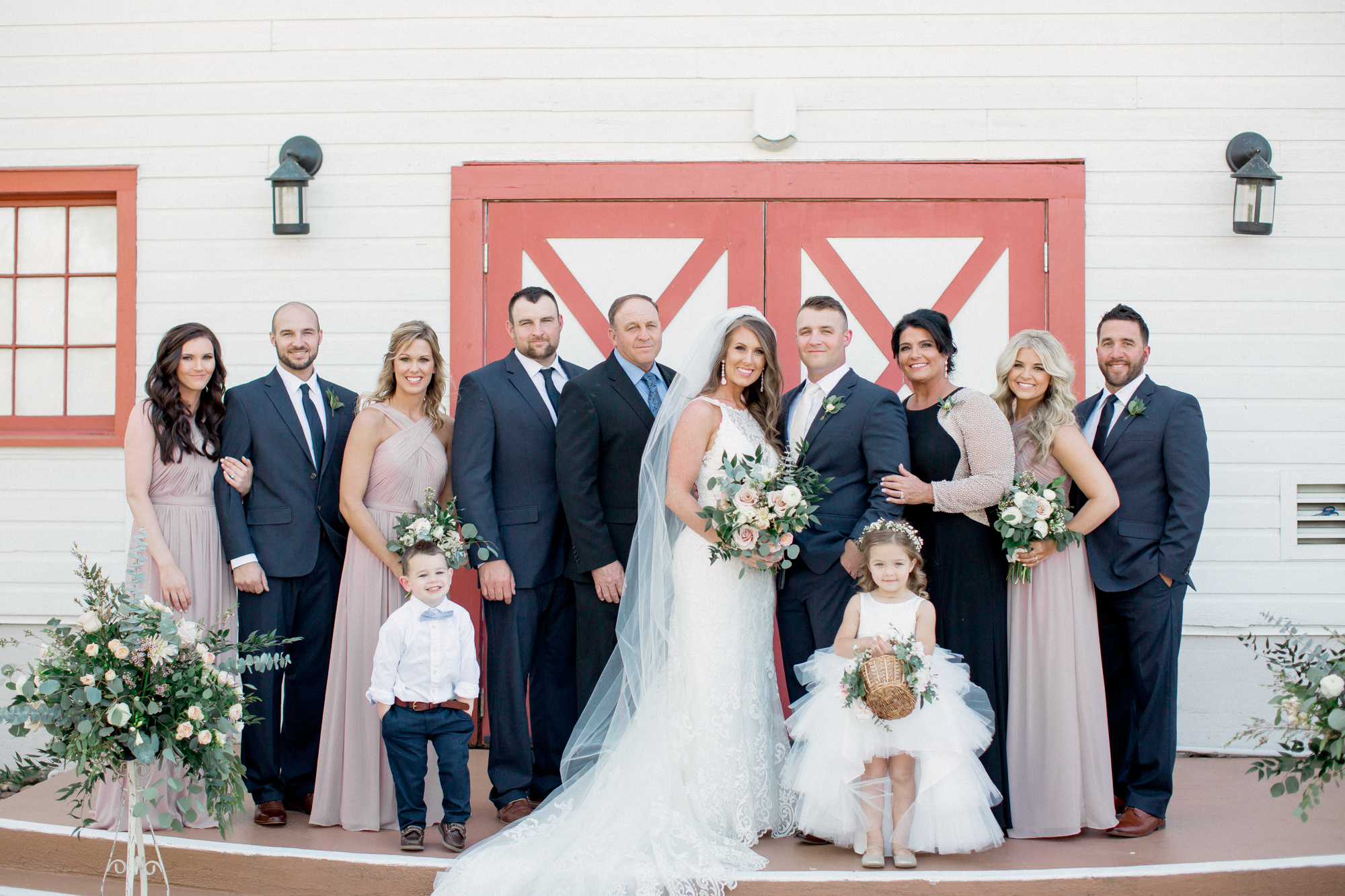 family photos in front of barn