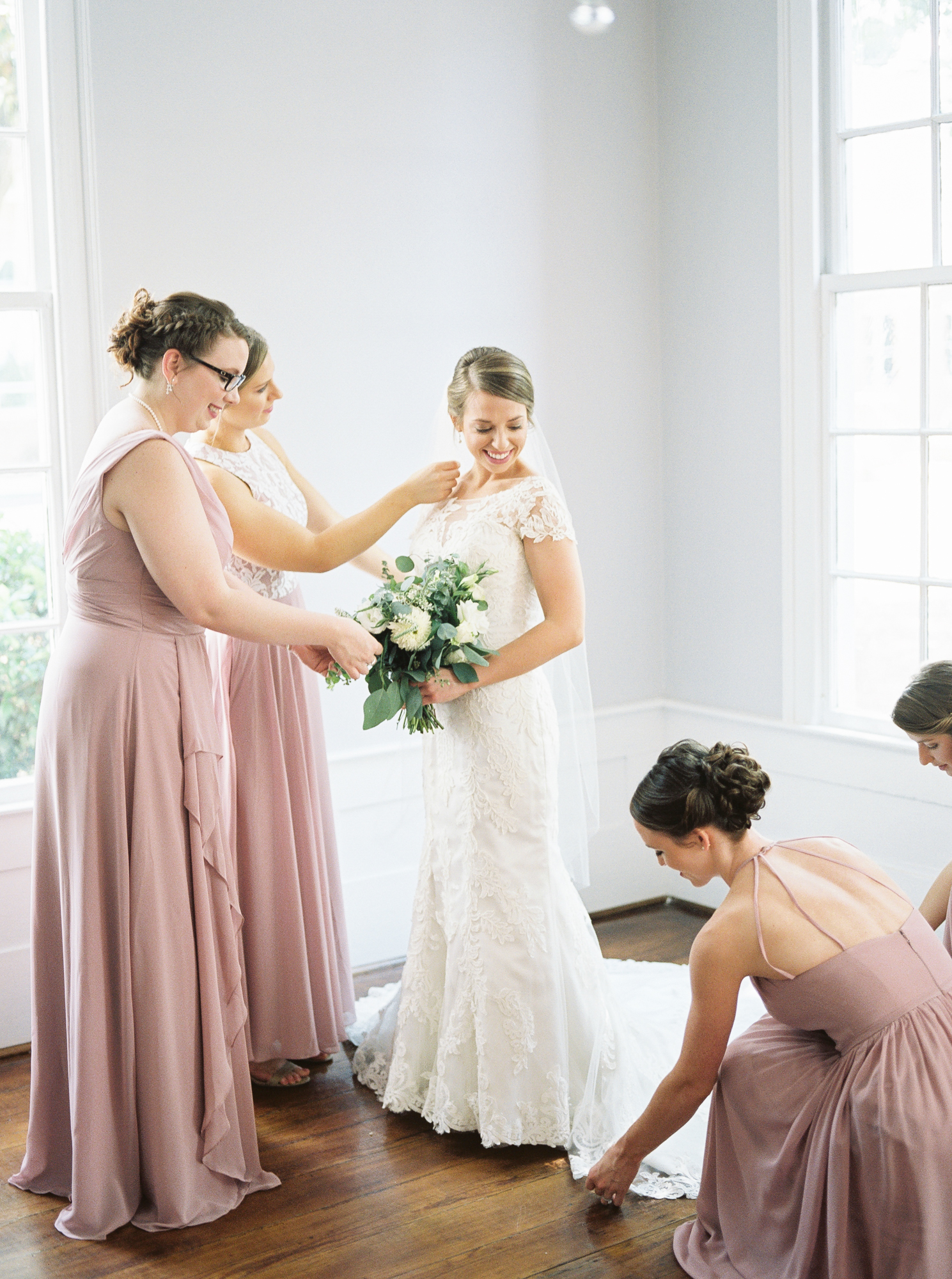 bridesmaids help bride get ready