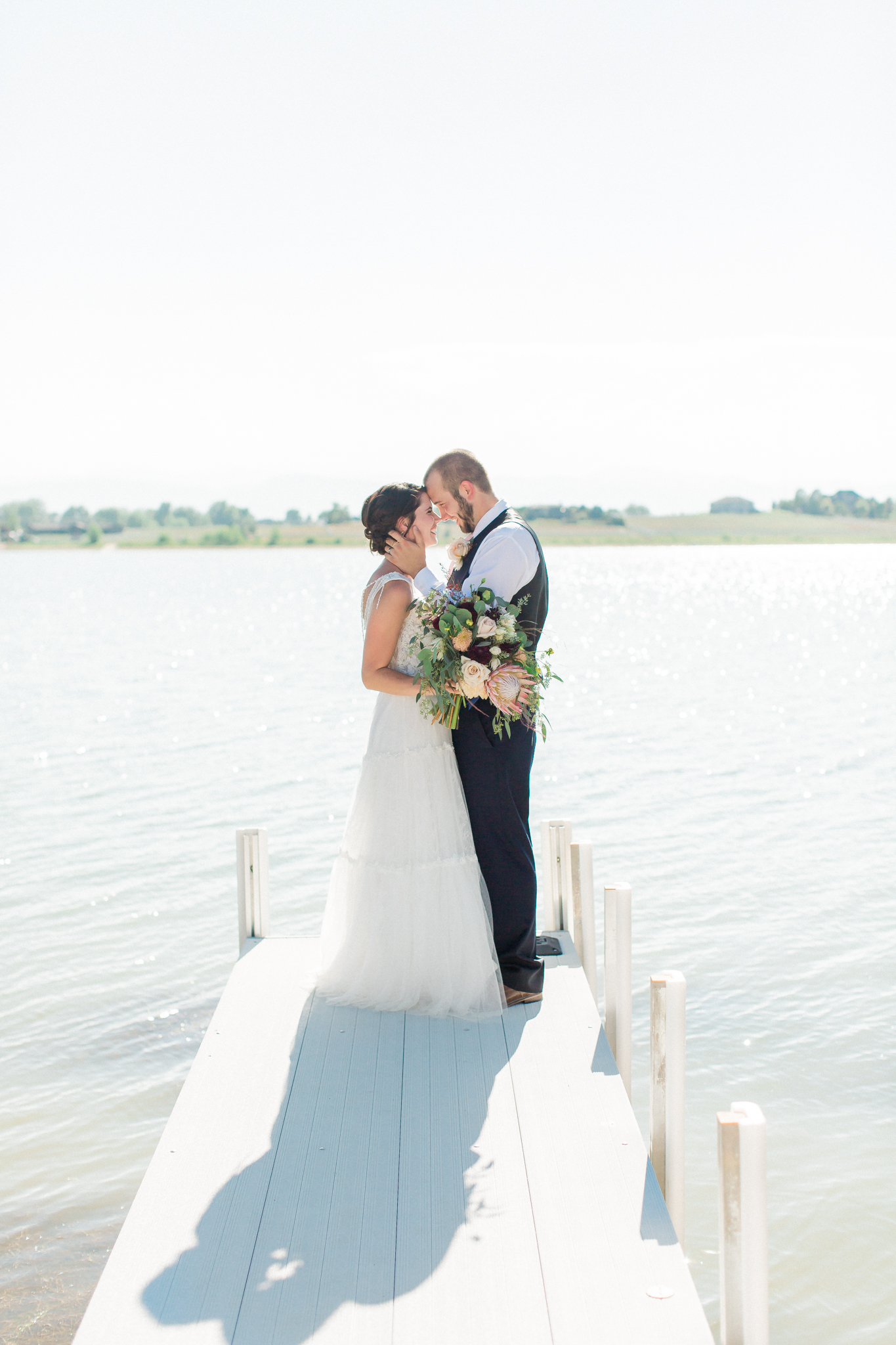 bride and groom on water colorado