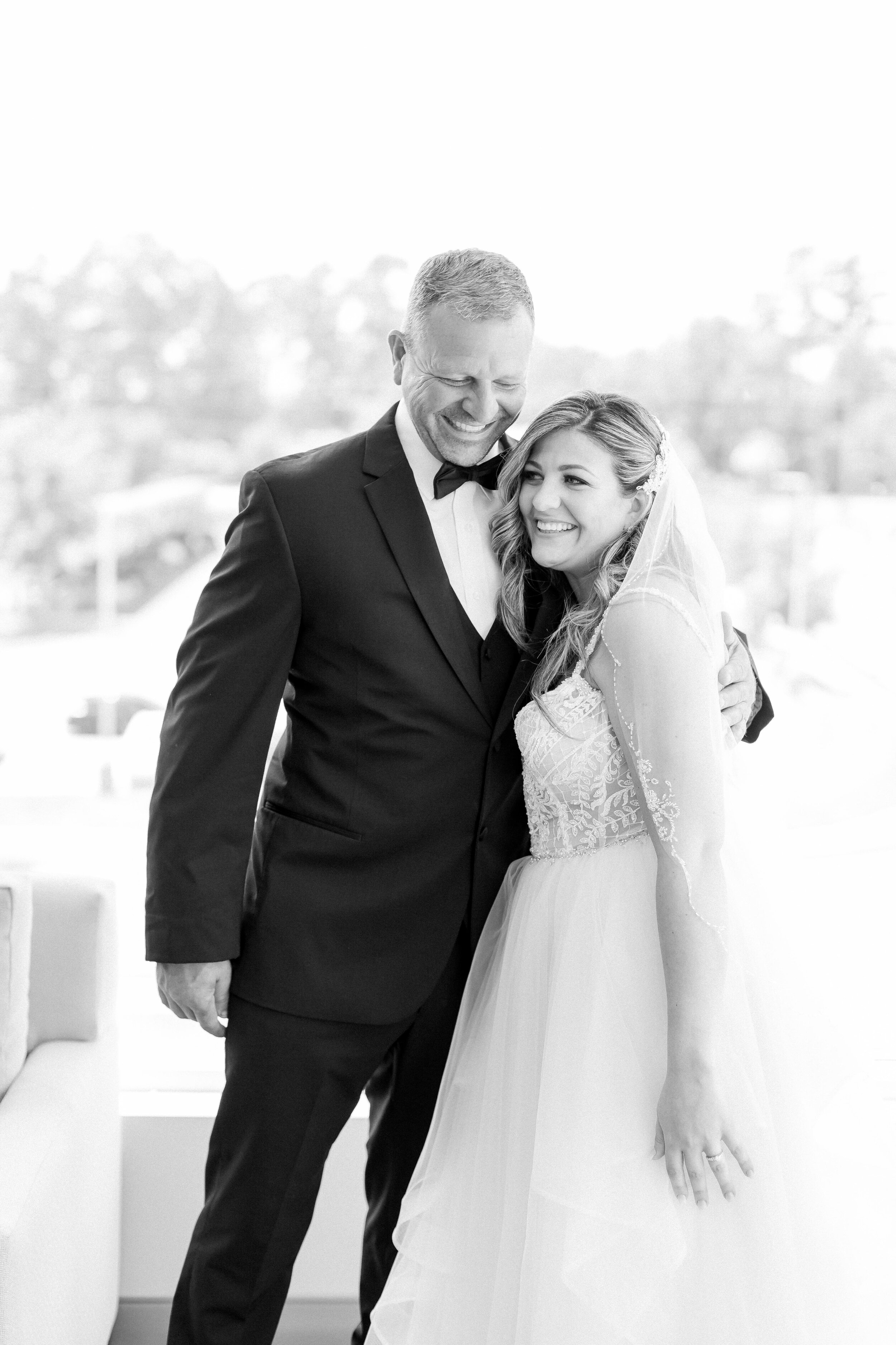 Black and white photo of daddy daughter on wedding