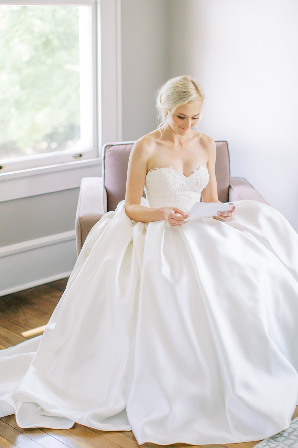 Bride reading letter at vanlandingham Charlotte NC