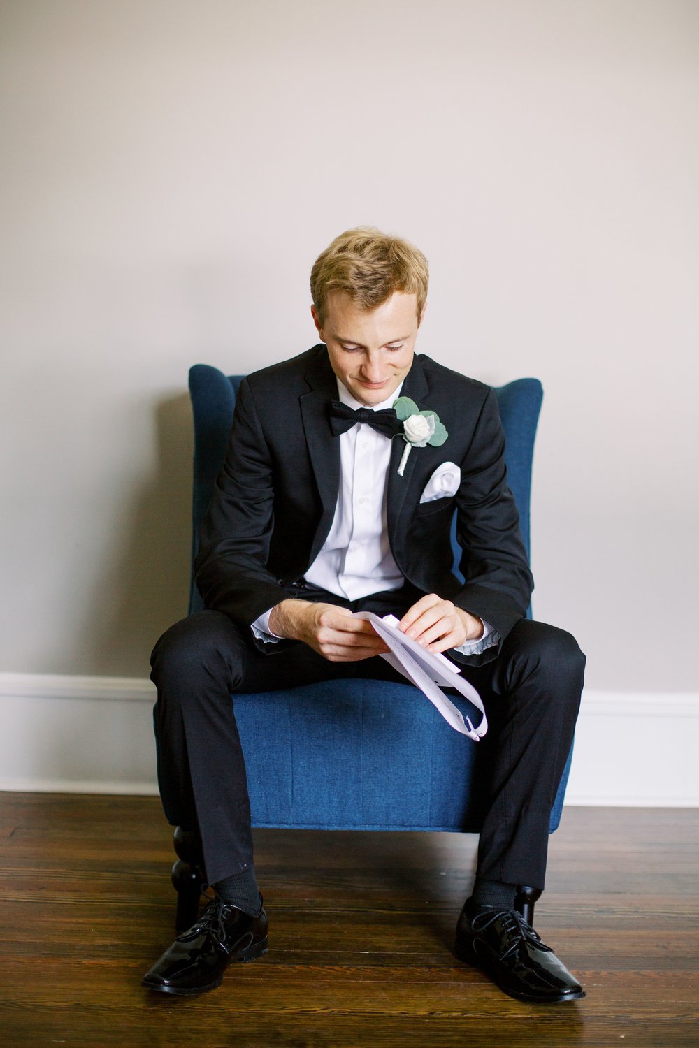 Groom reading letter at Vanlandingham Estate Charlotte