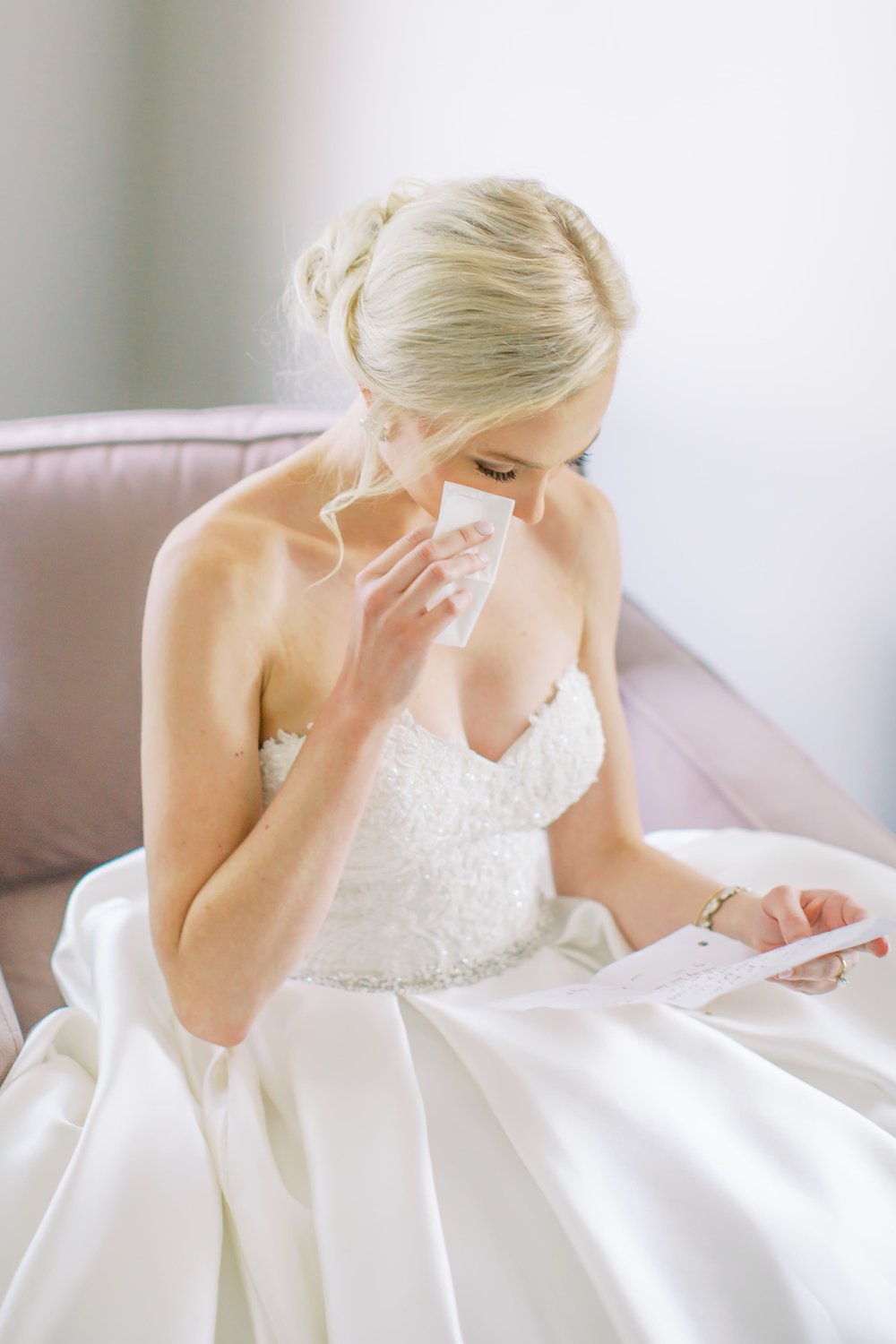 Bride cries reading letter from groom