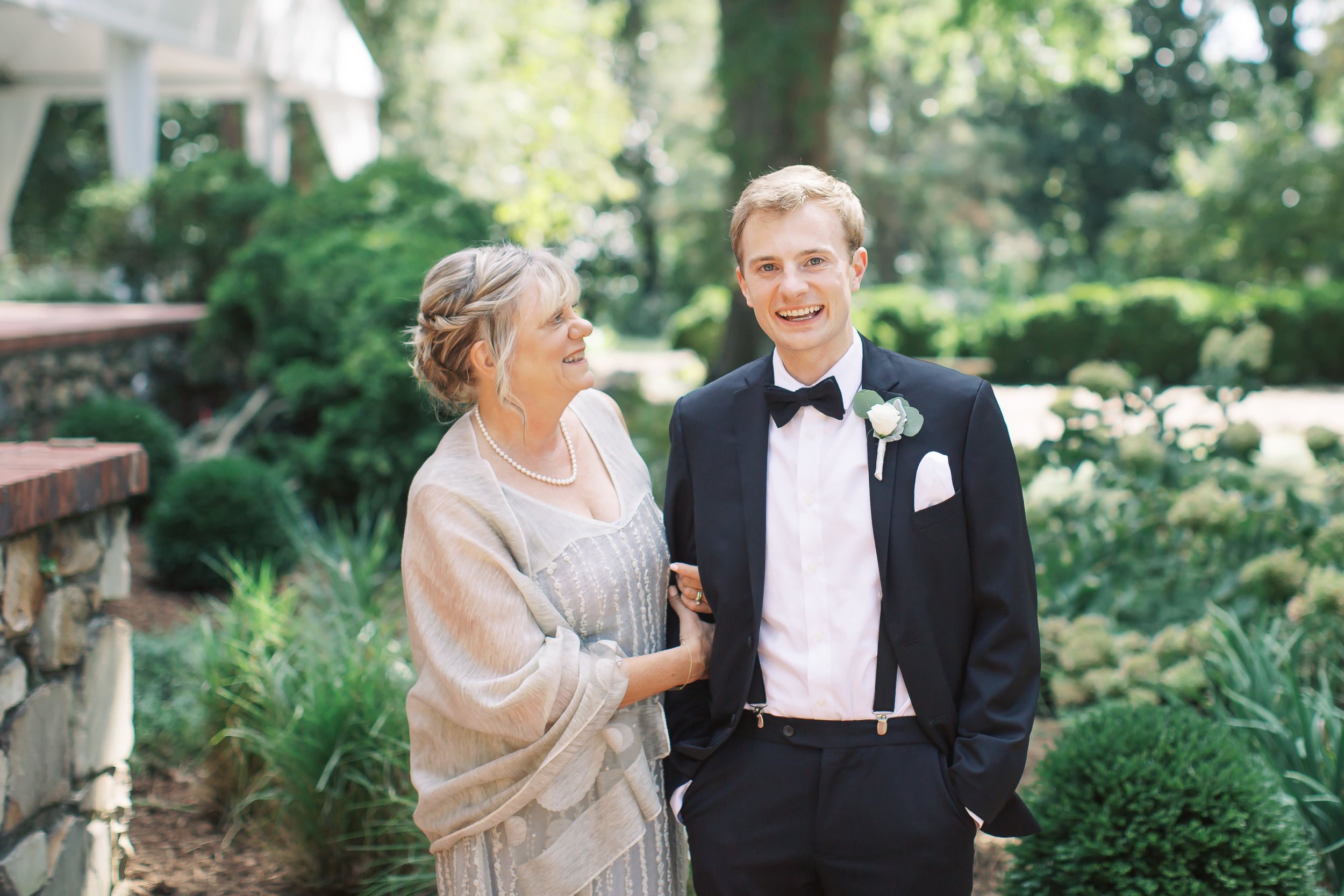 Groom with mom on wedding day at vanlandingham estate