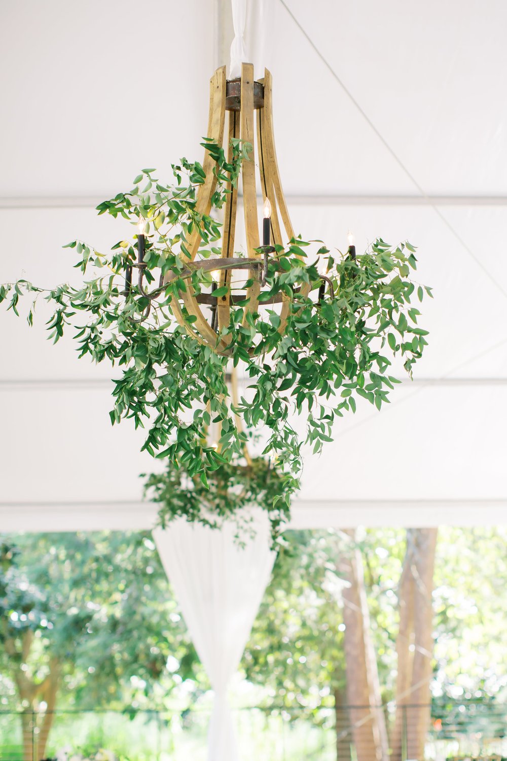 Greenery in chandelier at wedding