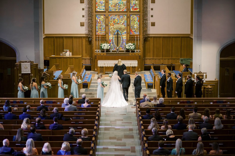 bride and groom at alter in church