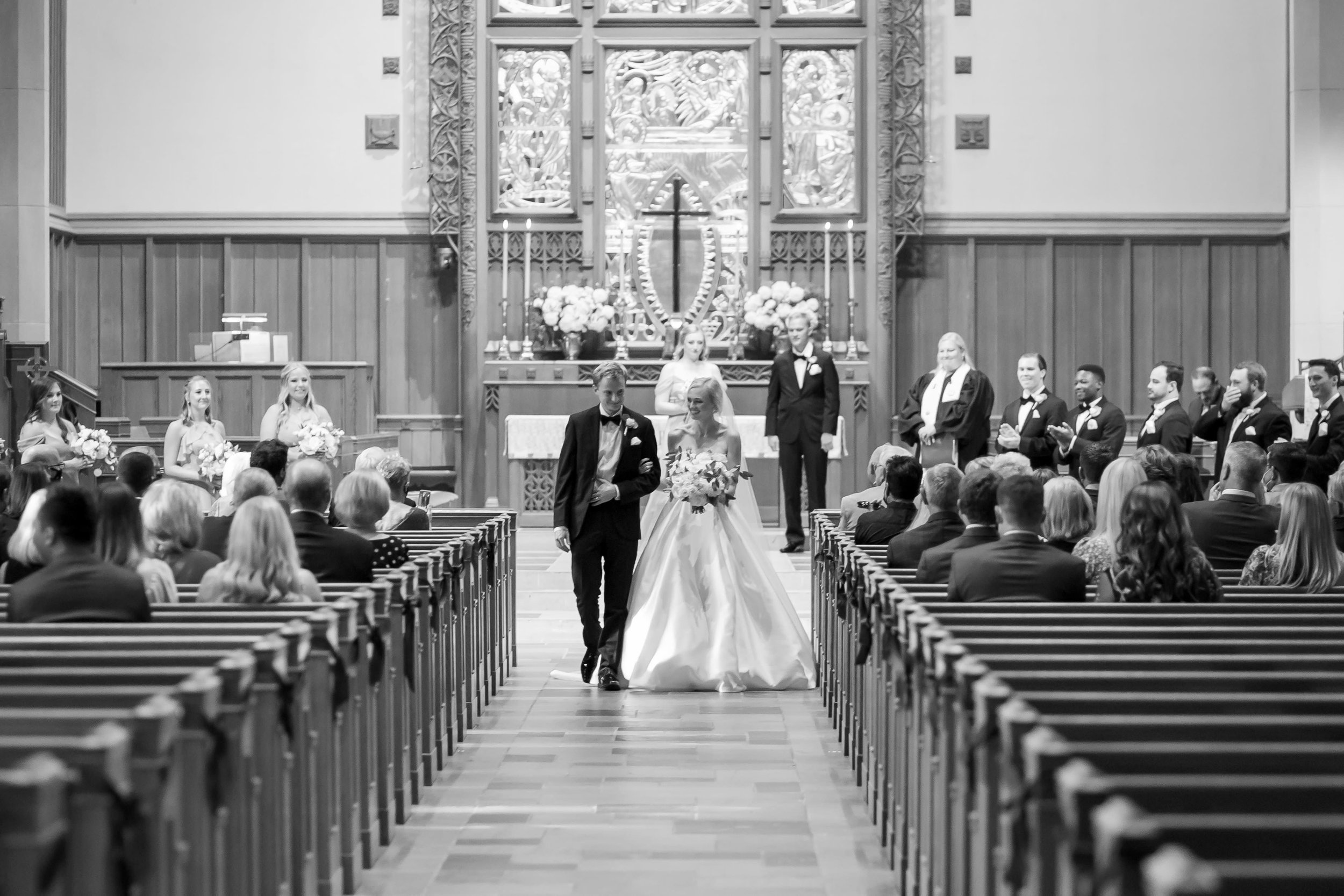 Bride and Groom walk back up the aisle