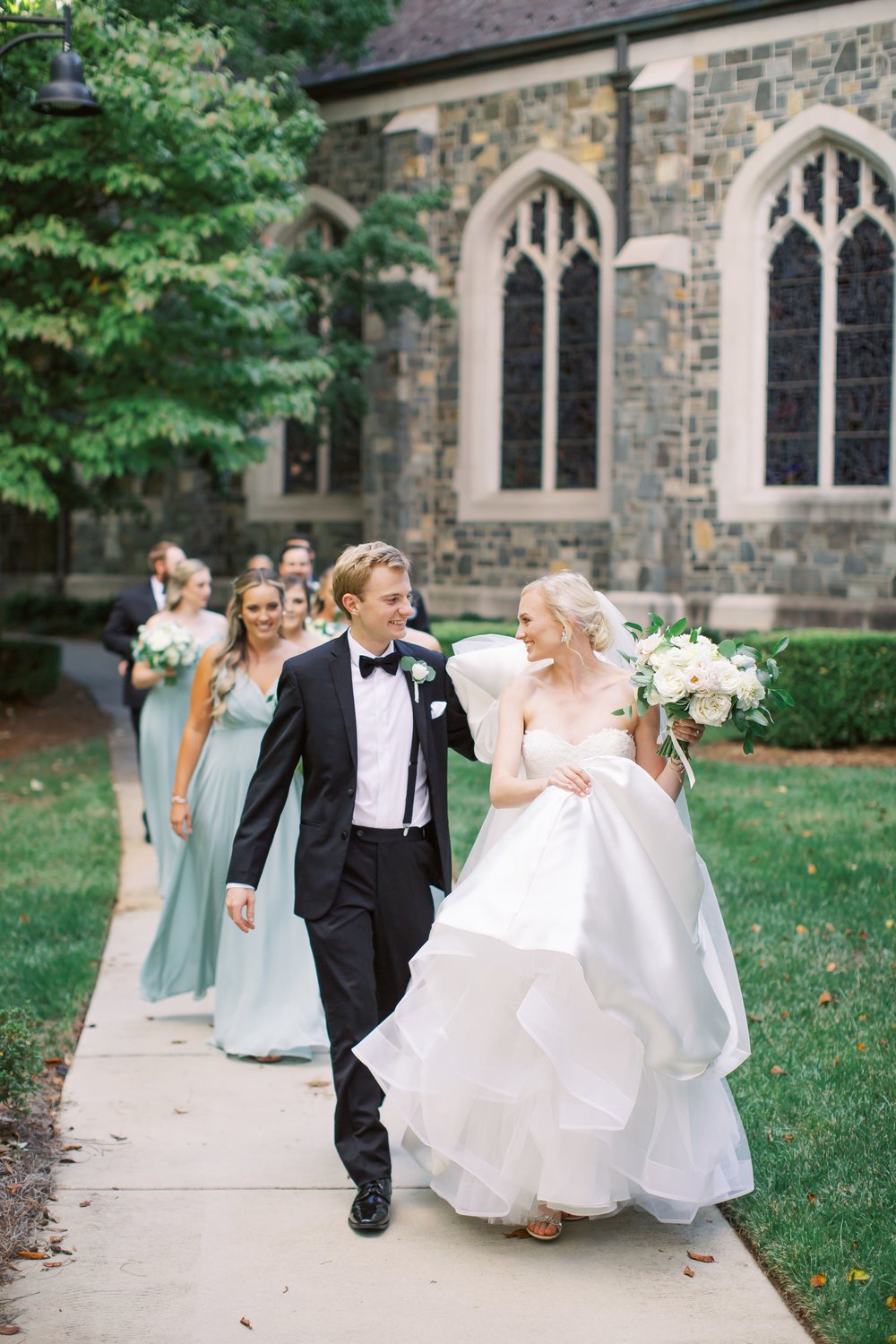 wedding party walking out of church