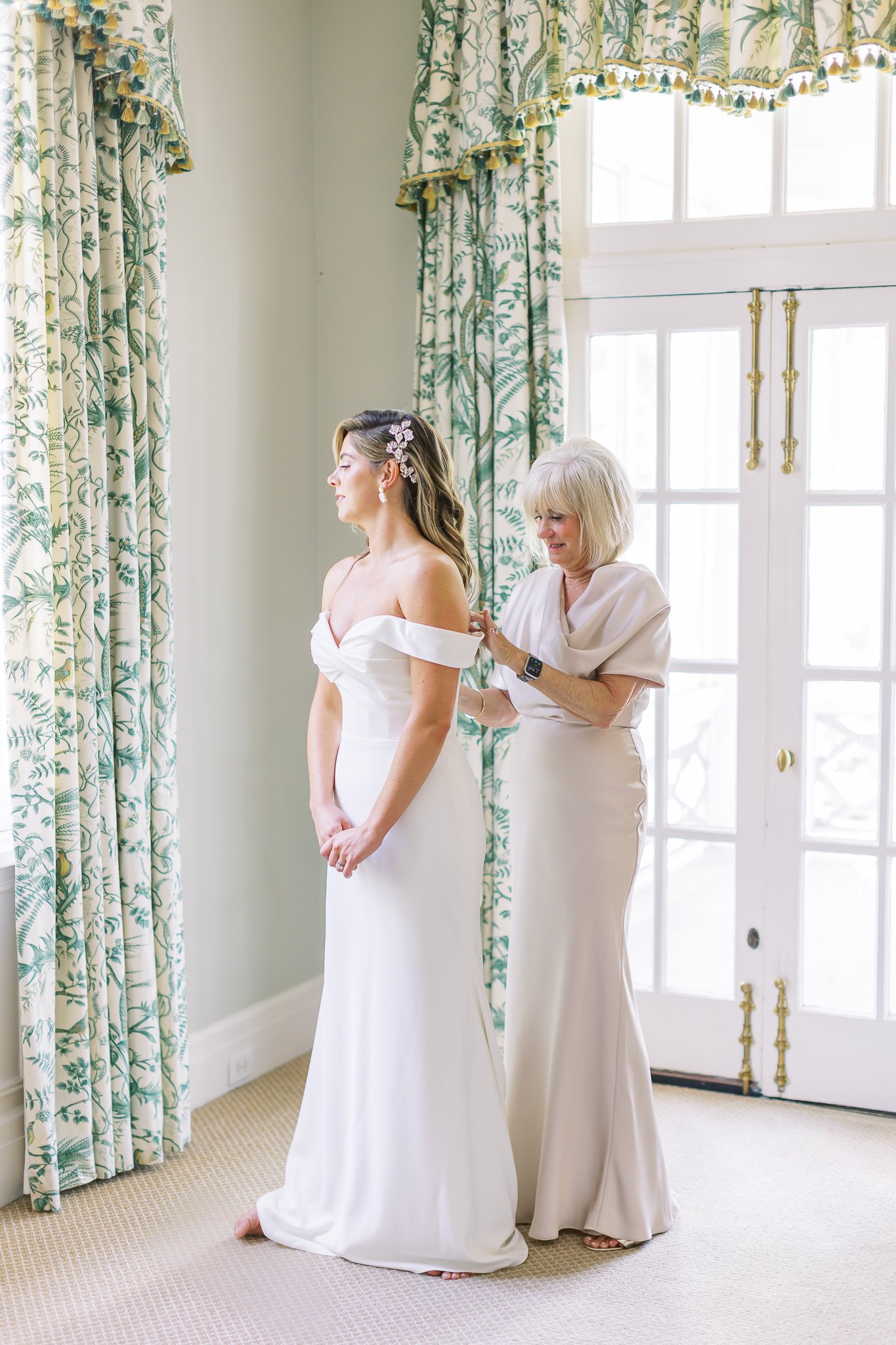 Bride getting into dress at Duke Mansion