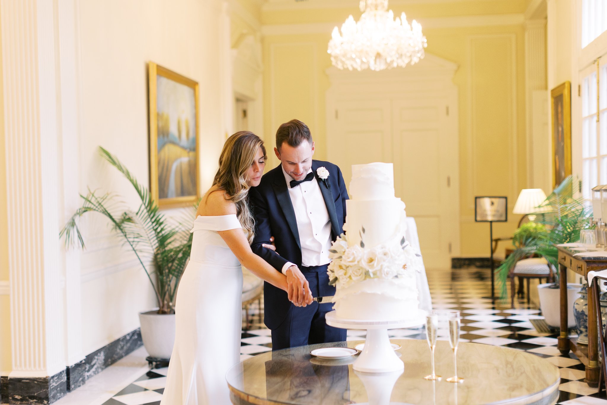 Cake Cutting Photo of Bride and Groom