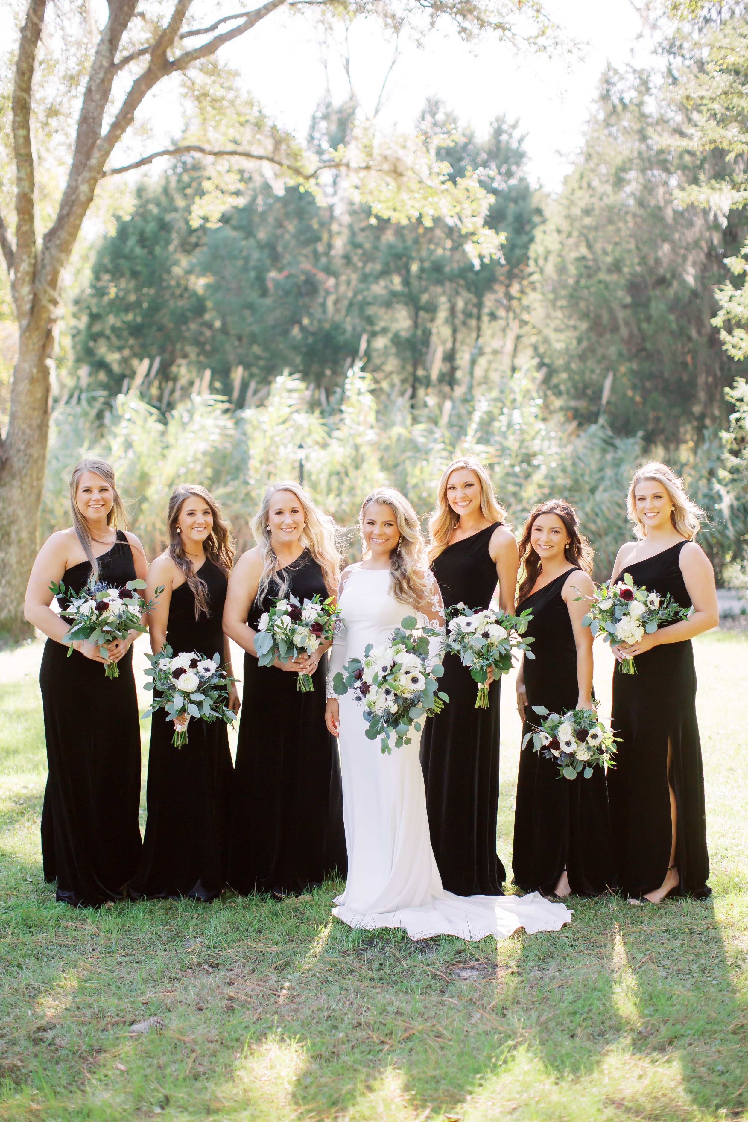 Bridesmaids black velvet dresses fall wedding