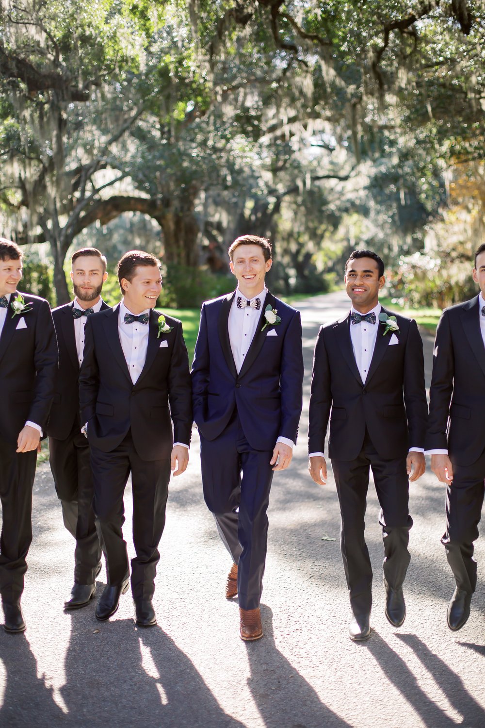 Groom with Groomsmen Walking Photo