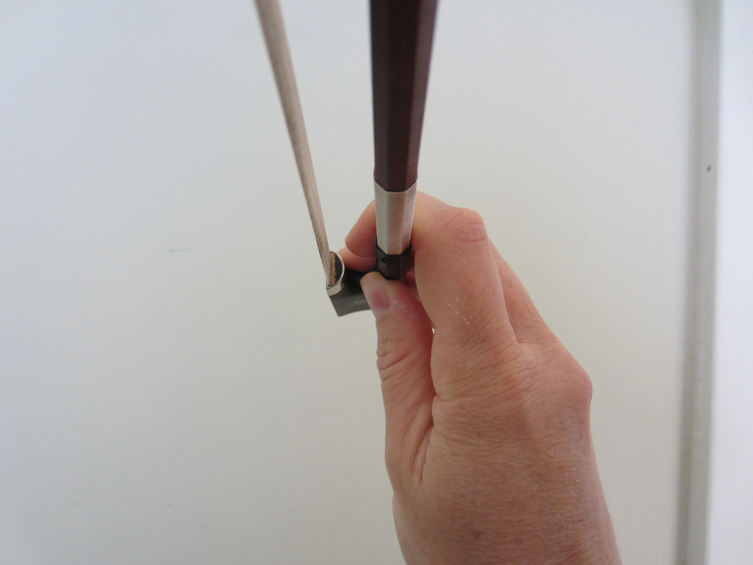  This is a bad example of the right hand thumb. Do&nbsp;not straighten the middle knuckle of the thumb. You're hand should create a tunnel. 