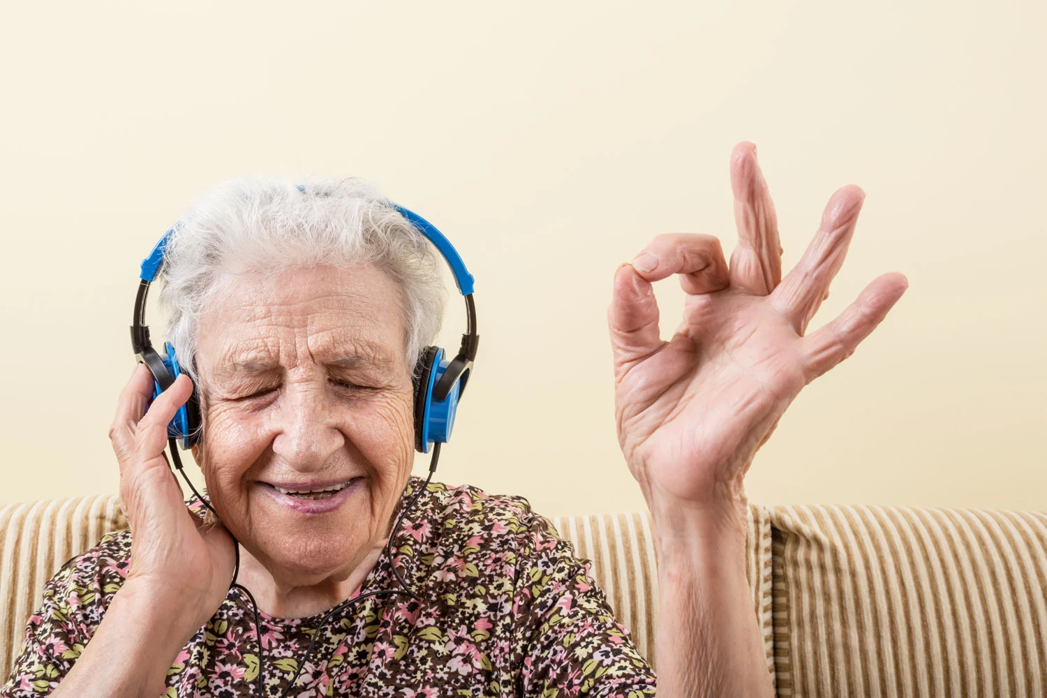 Grandma loving the tunes she is listening too with her massive blue headphones! bella magazine 