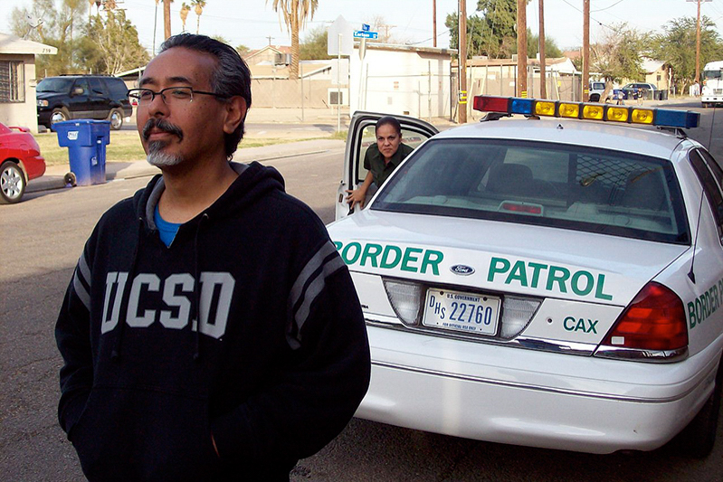 Ricardo_Dominguez_and_Border_Patrol_Agent,_Calexico,_California_2009 (1)_1 (1).jpg