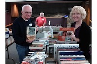 Book sale volunteers replenish the supply throughout the sale.