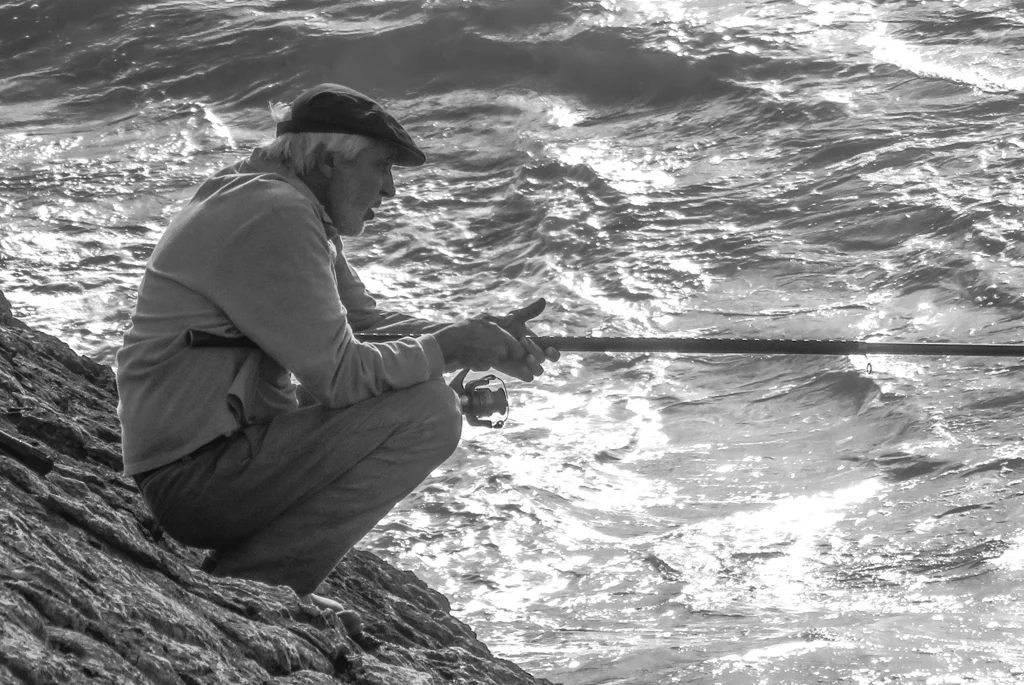 This older man and a few others fished near our hotel in Portugal each morning and evening. As he does here, these men often cast and waited motionless for fish. They perched precariously over the sea below them. They demonstrated great patience.