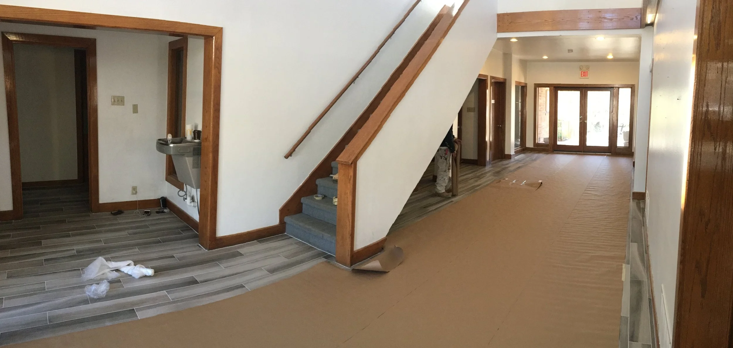 The new ceramic tile is covered while the ceiling is being painted. The trim will be next.