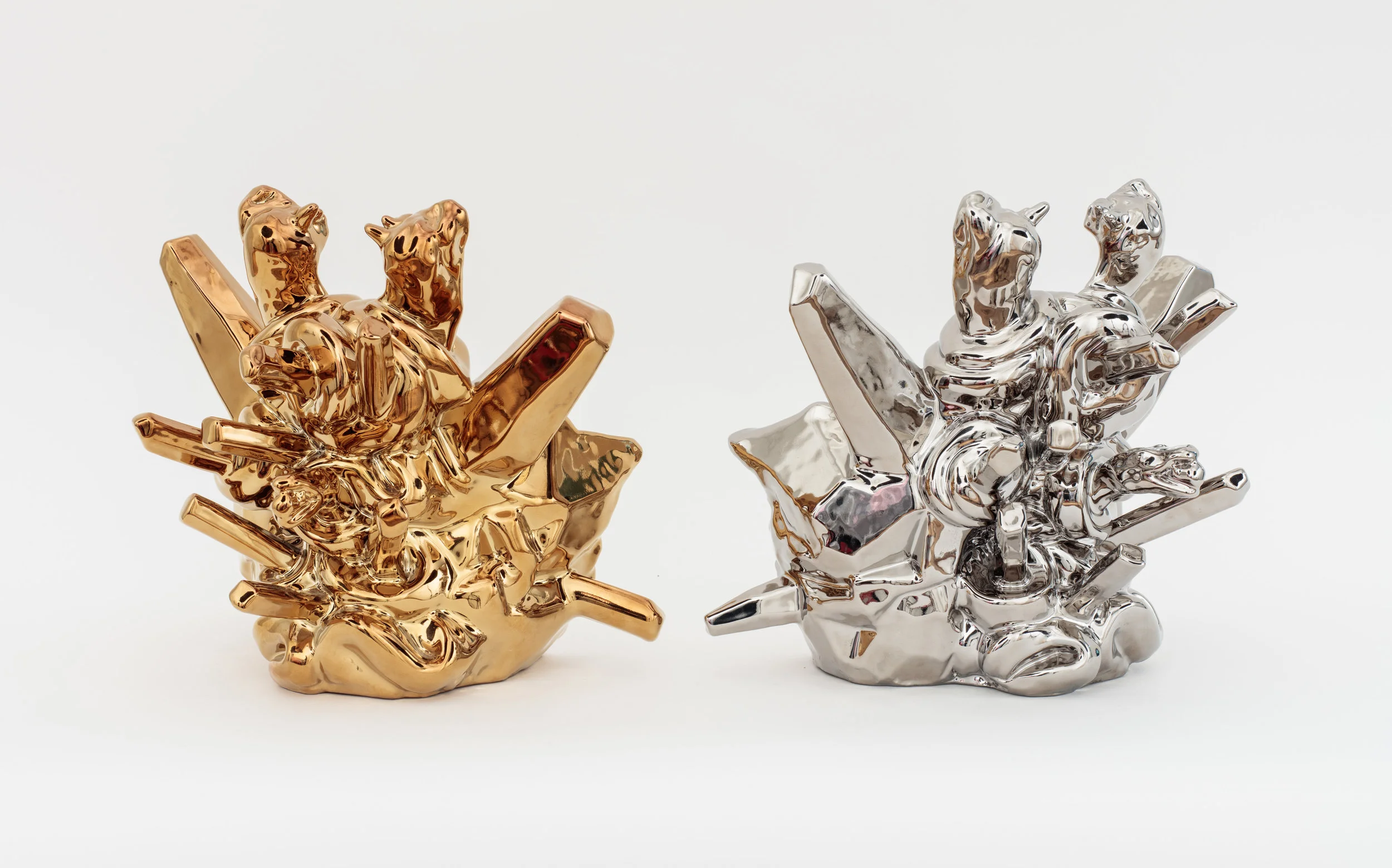 Chrome Cats , 2013, Media: Slip cast porcelain, glaze, PVD (Metallic plating); 11 x 11 x 11 inches (per piece); made at The Pottery Workshop, Jingdezhen, China