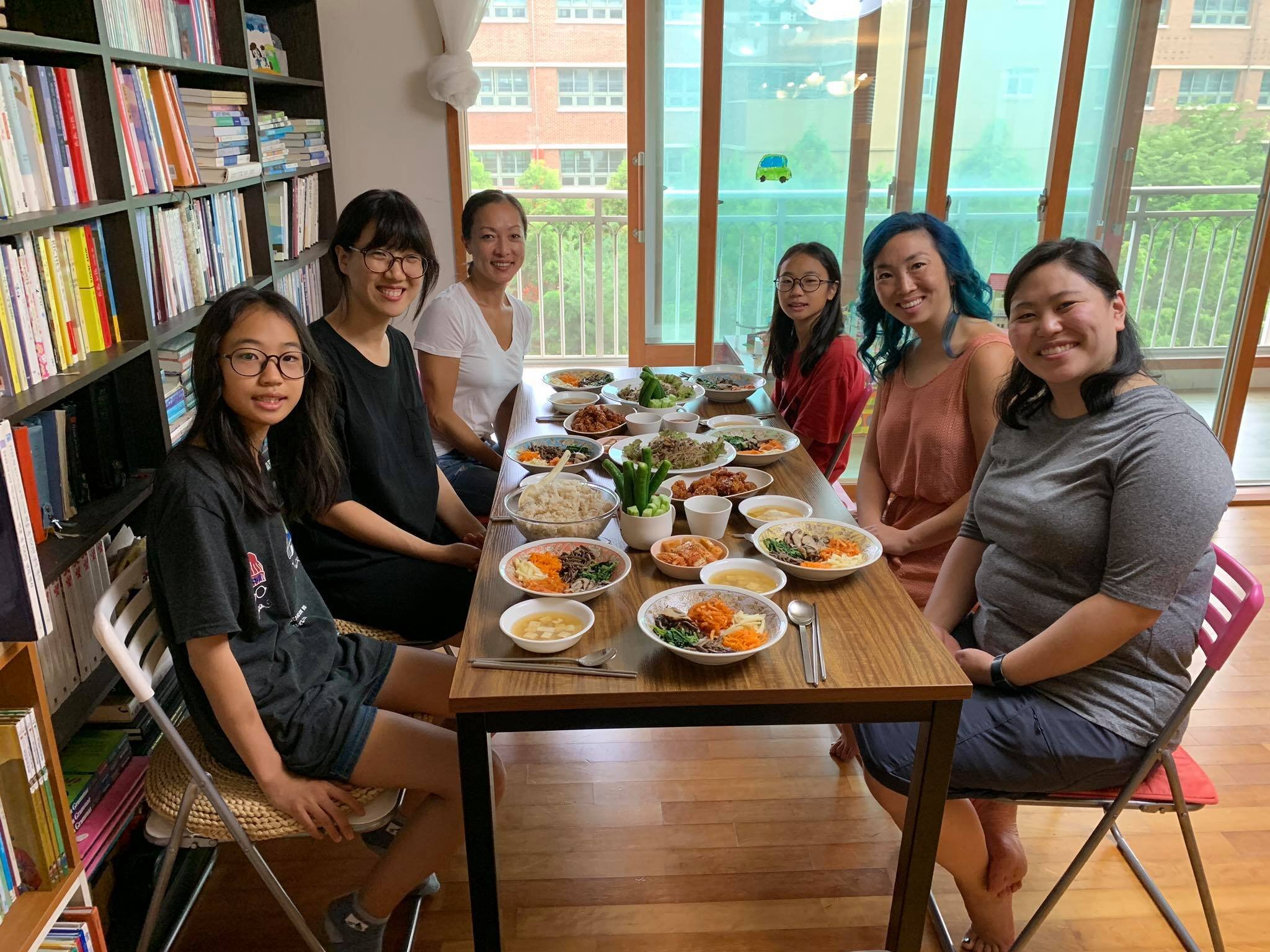 Adult adoptees enjoy a delicious meal with a host family (Copy)