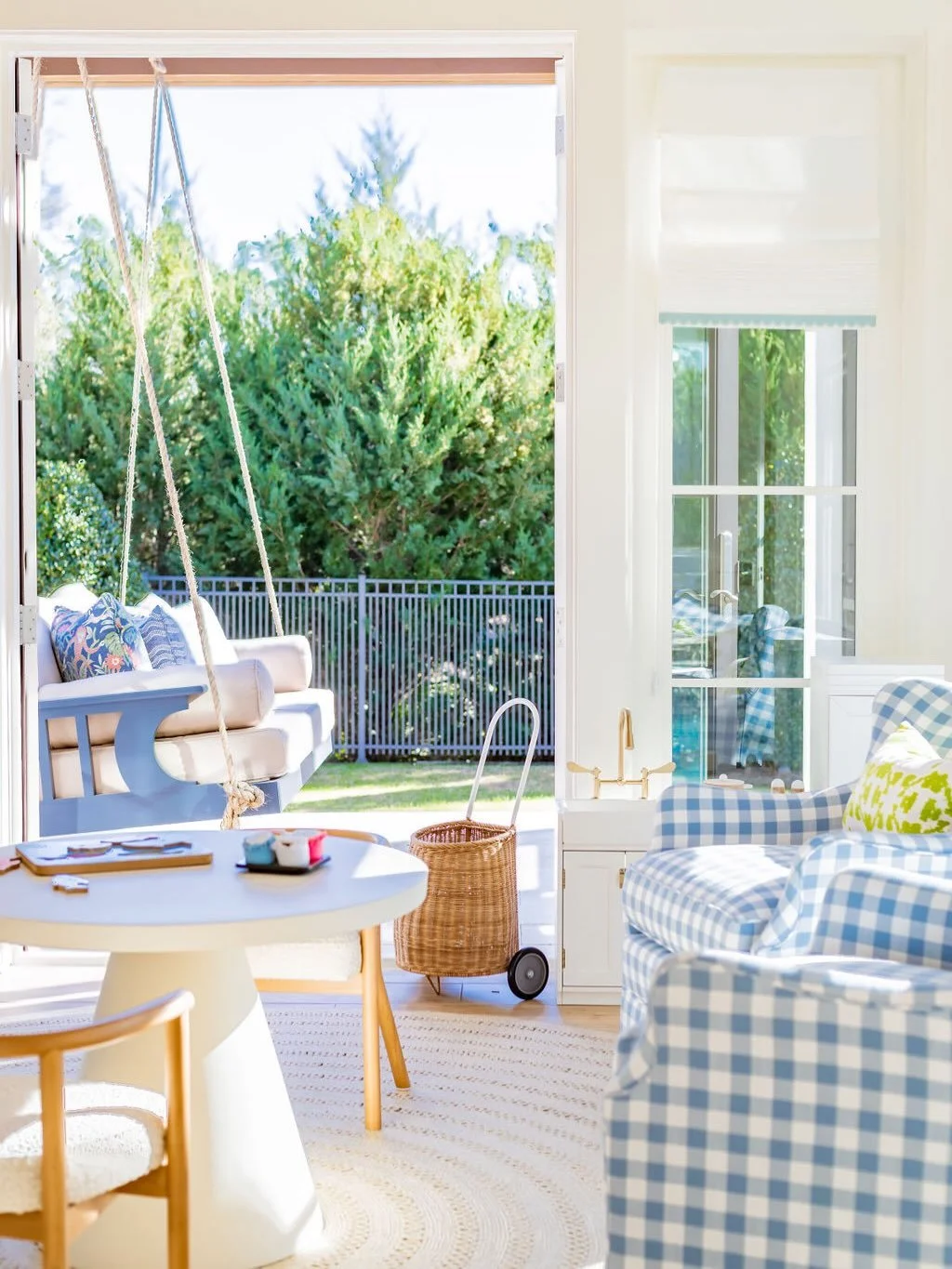 Such a sunny, happy space. The blue check pieces from @serenaandlily add just the right touch of charm. 💙