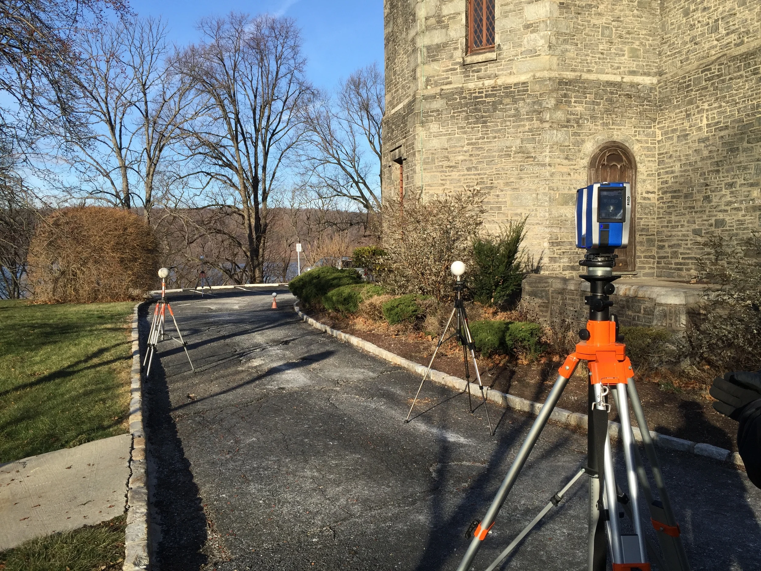 The laser uses the white spheres to orient itself and help combine scans from multiple locations.