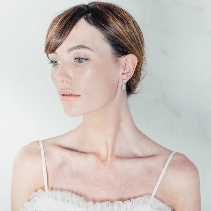 Seren earrings by Stephanie Browne are made with simply shaped mid sized sparkling oval and pear shaped crystals.