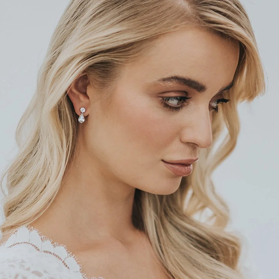 Seren earrings by Stephanie Browne are made with simply shaped mid sized sparkling oval and pear shaped crystals.