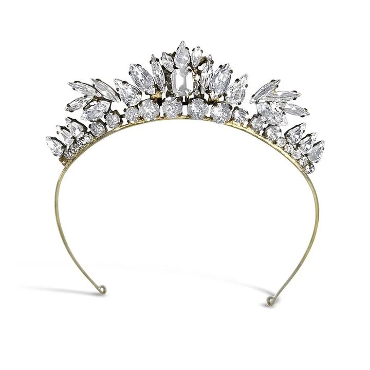 The Lily of the Valley has branches of Swarovski crystals arch over to create this beautifully handcrafted heirloom tiara.