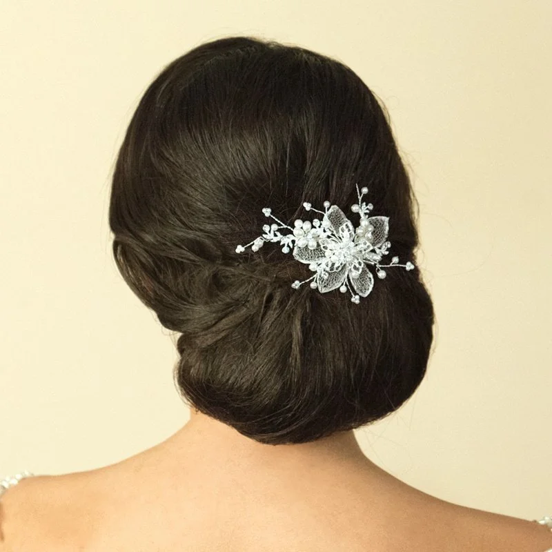 A really pretty hair clip using real silver Italian mesh work to create petals and covering with cut solitaire stones and natural lustre man made pearls in a flower vine pattern.