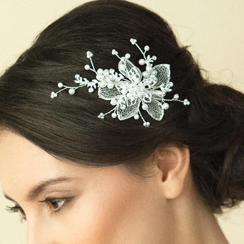 A really pretty hair clip using real silver Italian mesh work to create petals and covering with cut solitaire stones and natural lustre man made pearls in a flower vine pattern.