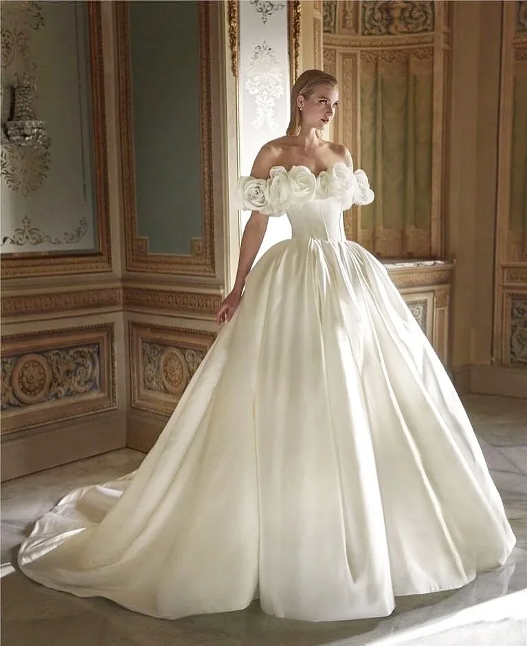 Happy Monday, beautiful brides-to-be! 🤍 We are absolutely loving these statement necklines. Which would you choose: the elegance of Romantic Rose or the charm of Fabulous Ruffles? 

Pictured: Dress Evarly with the gorgeous rose detail by @pronovias 