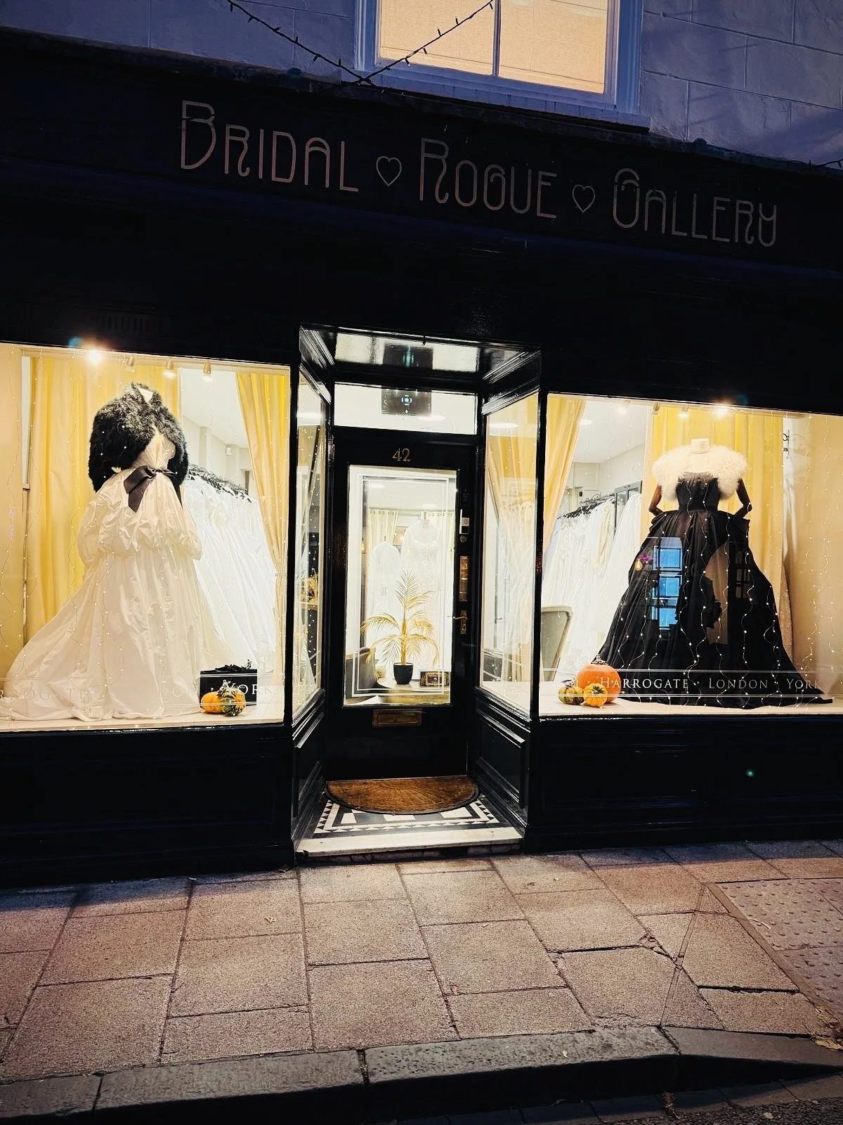 Our window turns monochrome for the Halloween season - timeless off-white paired with bold black.
 Two gowns, two moods - both equally captivating in their own way. Do you see yourself in the refined, graceful off-white look&hellip; or would you choo