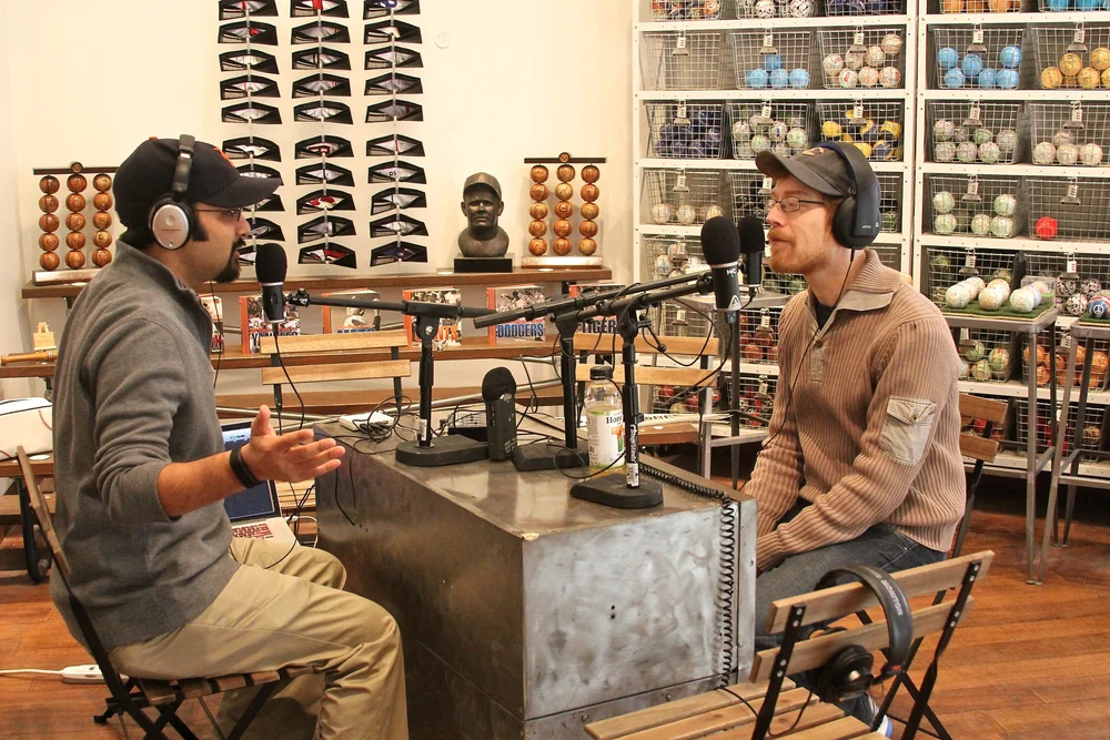  Muneesh Jain and Anthony Rapp talking baseball 