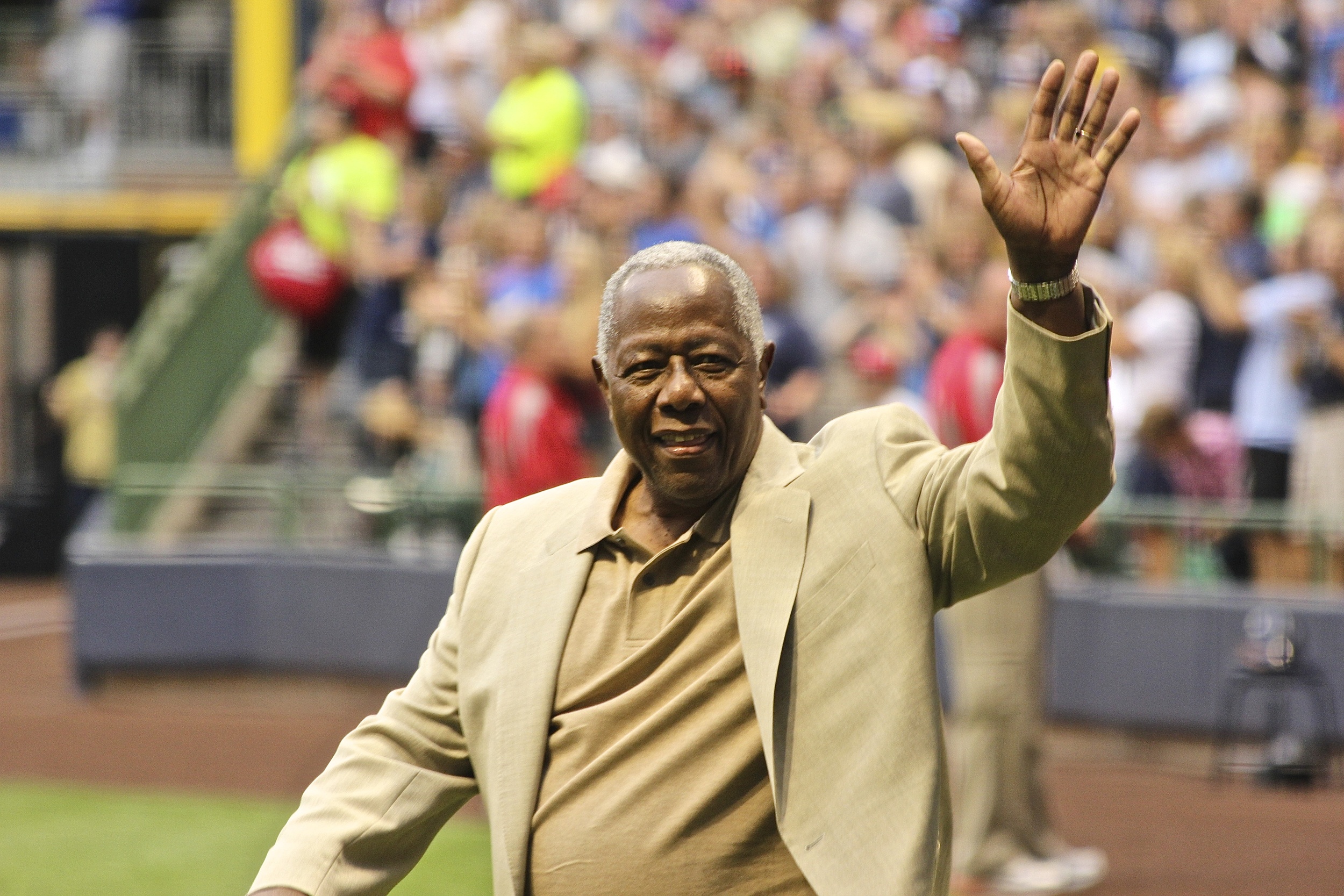  Muneesh's favorite picture from his 30-stadium tour of Hank Aaron walking onto the field at Miller Park. 