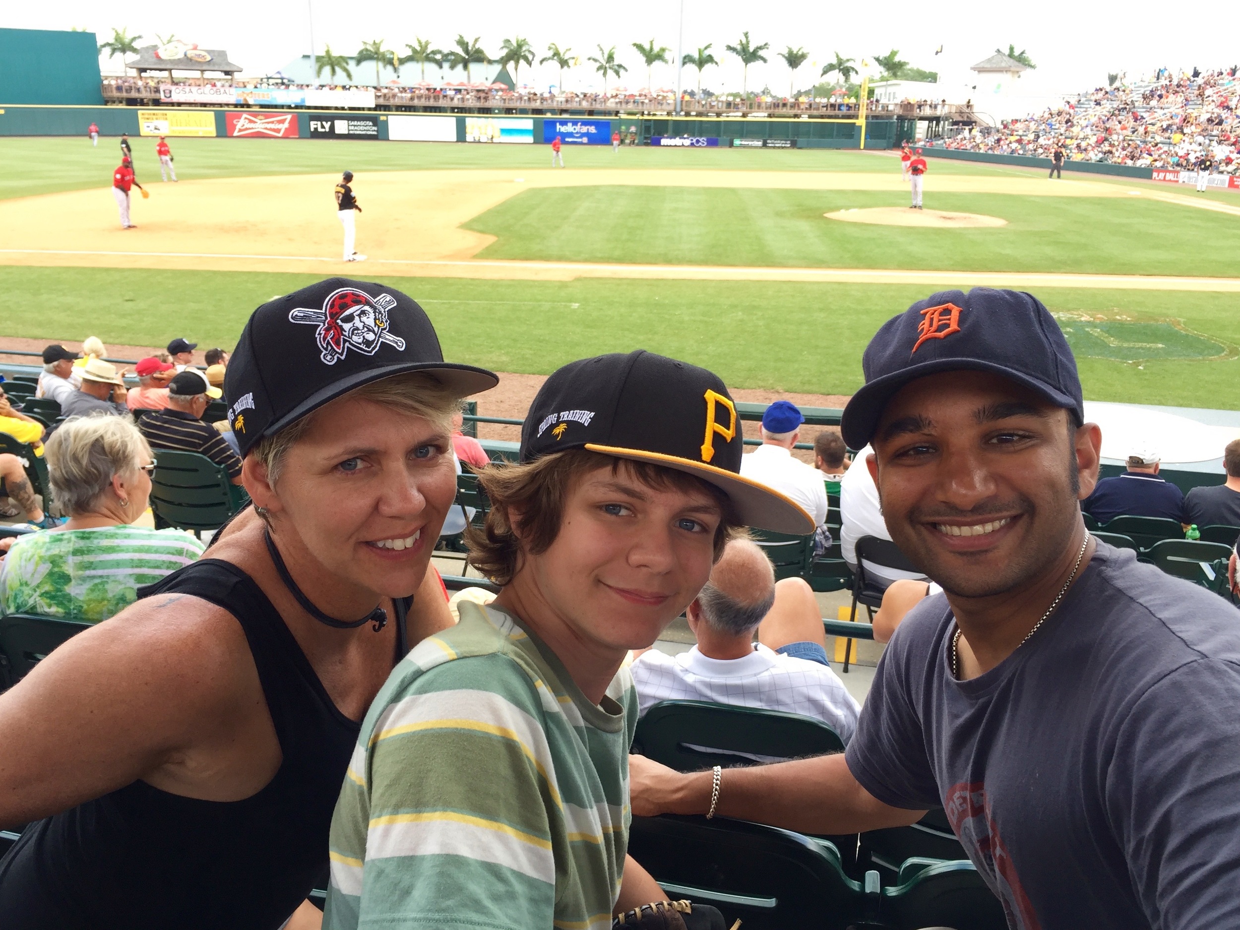 Ty, Muneesh and Monique watching a Pirates game